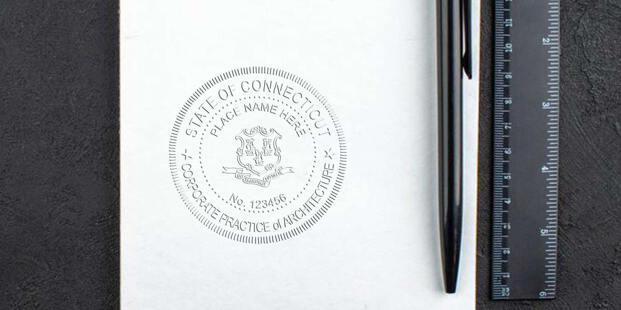 Connecticut corporate architecture seal on white paper with black pen and ruler on black textured surface, showing architect stamp laws and compliance in Connecticut.