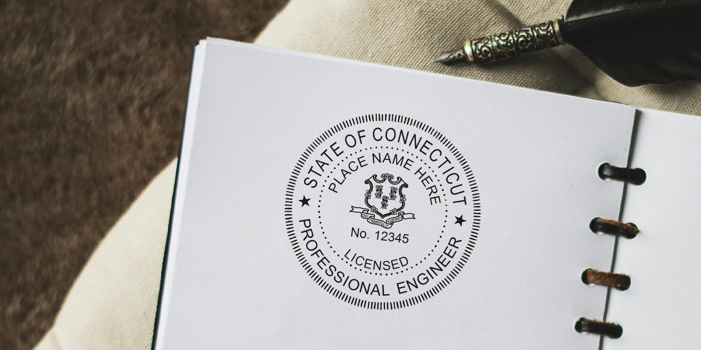 Connecticut engineer stamp on official document with vintage pen nearby; purchase engineer stamps online today.