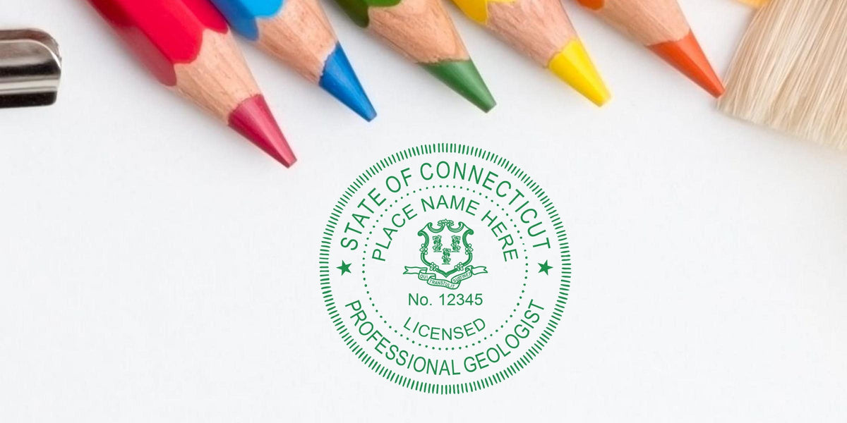 Connecticut licensed professional geologist seal with colored pencils and paintbrush on white, showcasing Connecticut geologist stamp and related regulations.