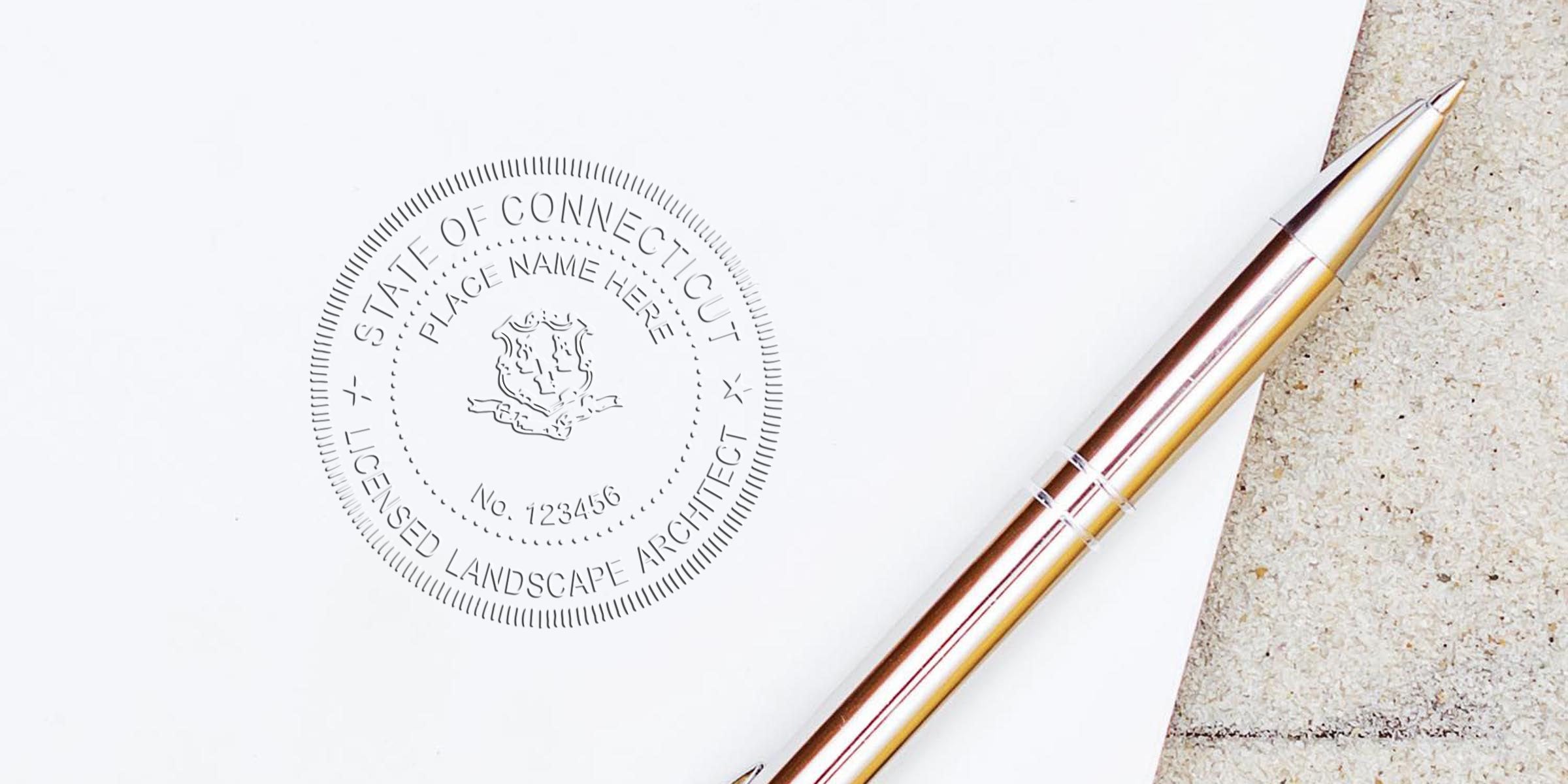 Connecticut licensed landscape architect seal on white paper with silver pen, showing CT landscape architect stamp and following CT stamp regulations.