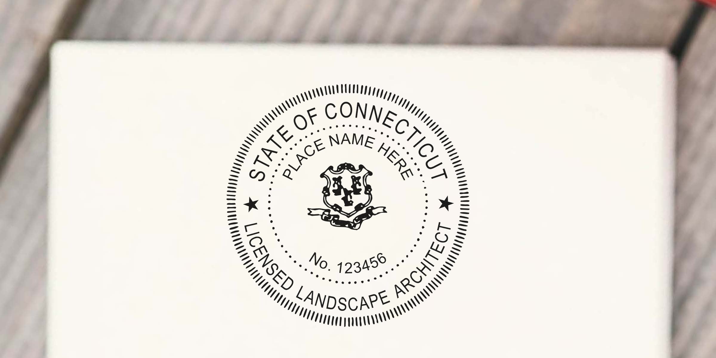 Connecticut landscape architect license seal on white paper, meeting state requirements for professional certification.
