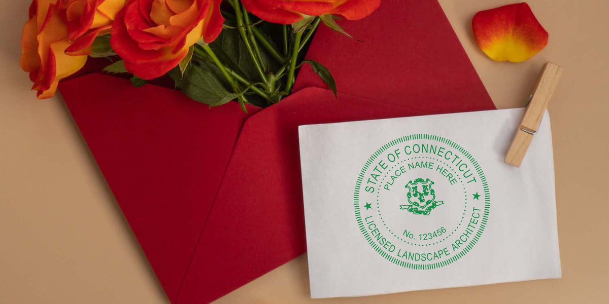 Red envelope with orange roses and a white card featuring the Connecticut landscape architect seal, showcasing licensing guidelines.