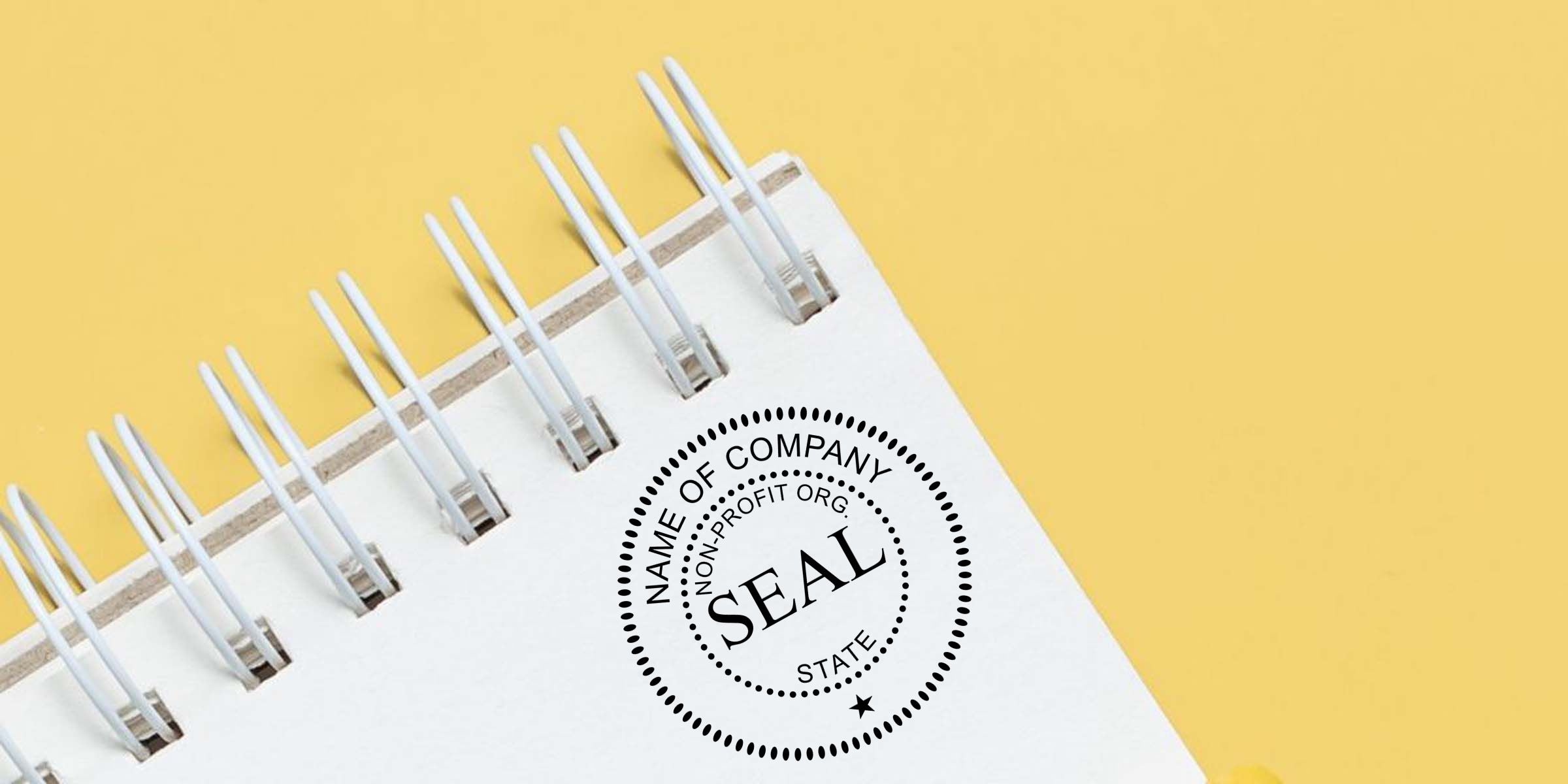 Notebook page with company seal stamp, non-profit organization label, and yellow background, symbolizing business branding and official approval