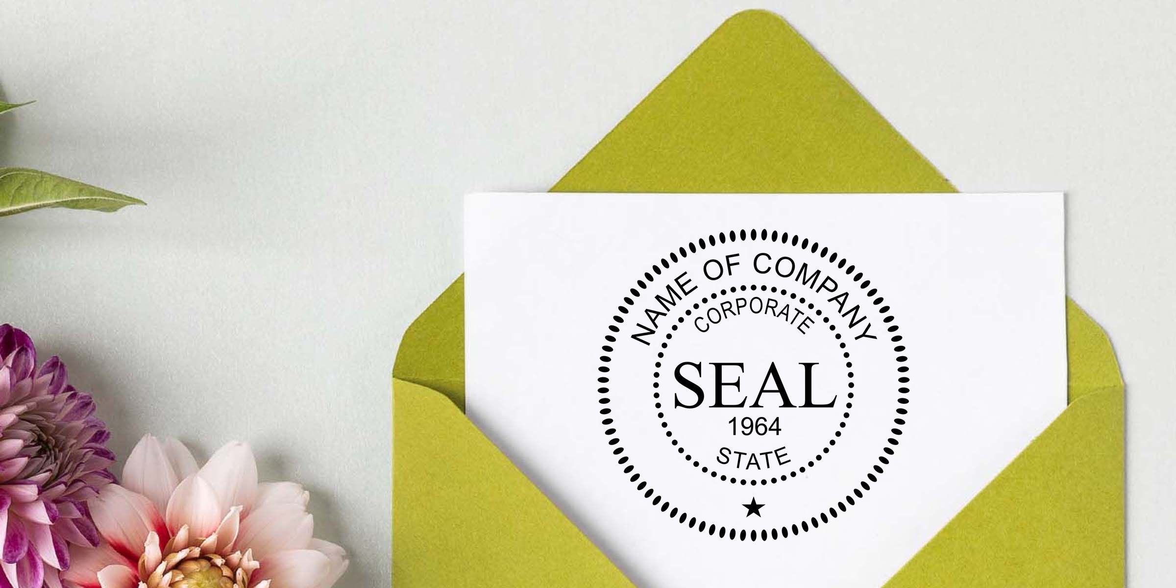 Custom corporate seal stationery card in a lime green envelope beside purple and pink flowers on a white background