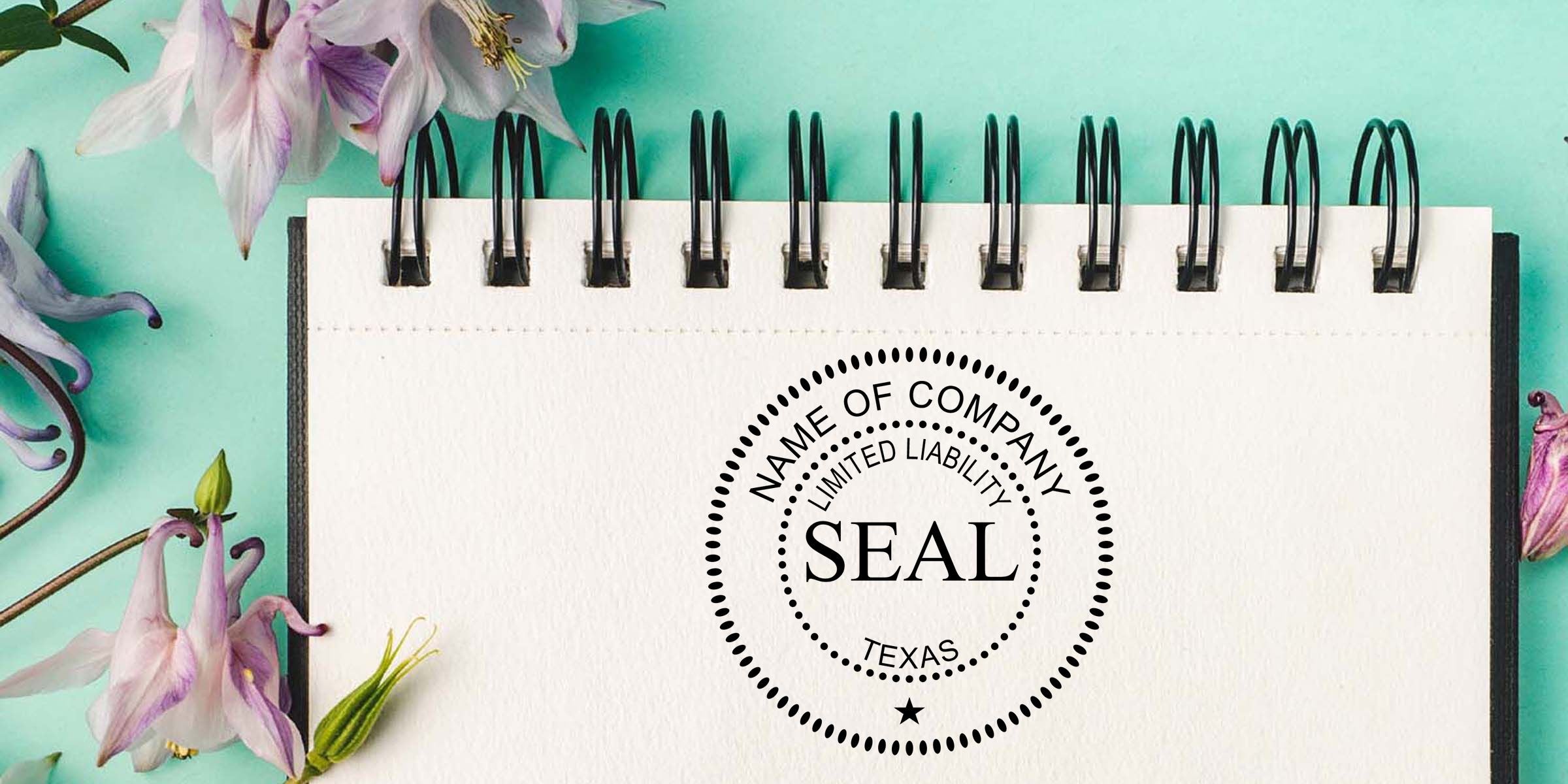 Spiral notebook with a Texas limited liability company seal template on a teal floral background