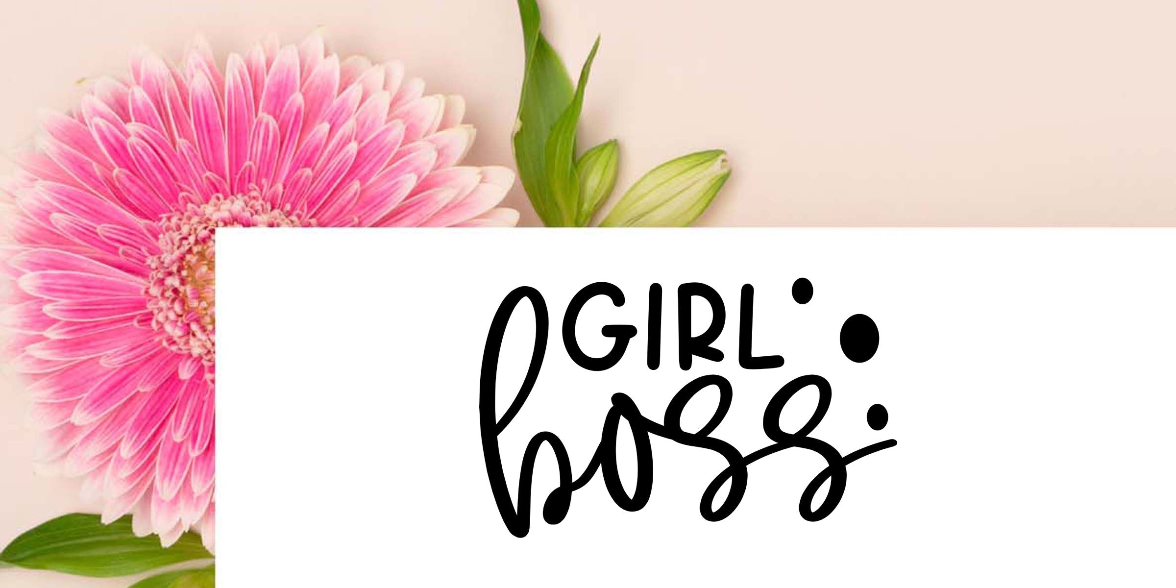 Pink gerbera daisy and green leaves with stylized Girl Boss lettering on a white card