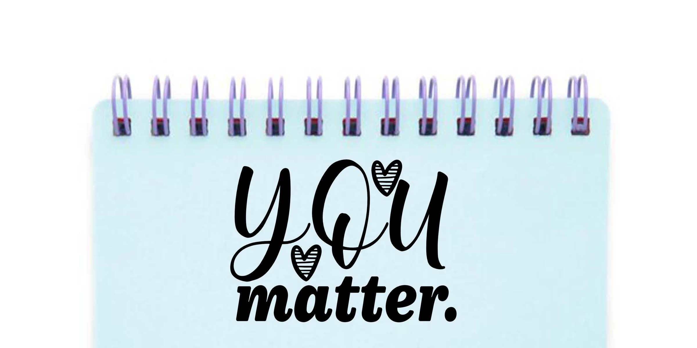 Light blue spiral notebook with the words “You matter” in black script and decorative heart accents on the cover