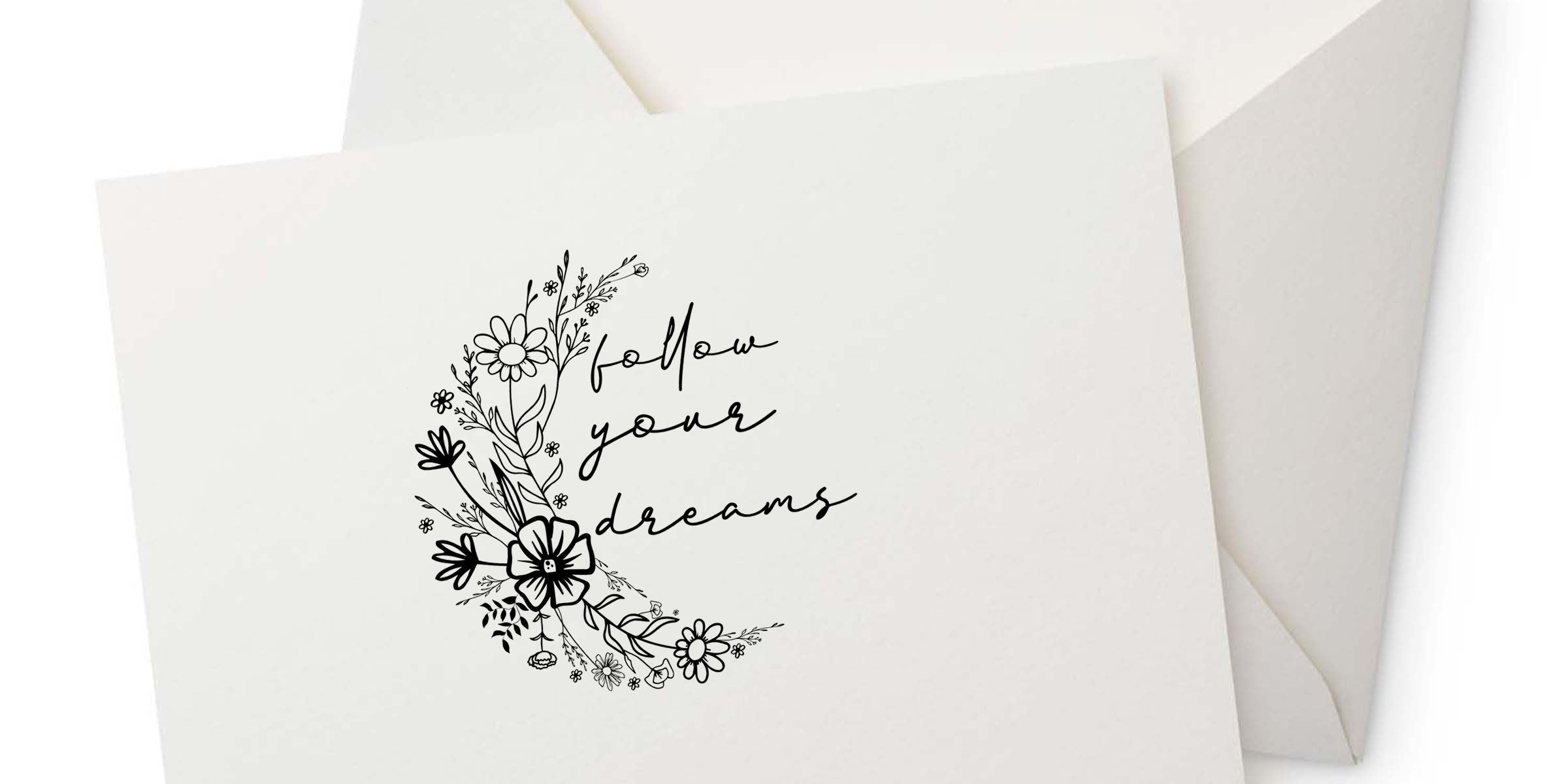 Minimalist floral greeting card with “follow your dreams” inspirational quote on white stationery with envelope background