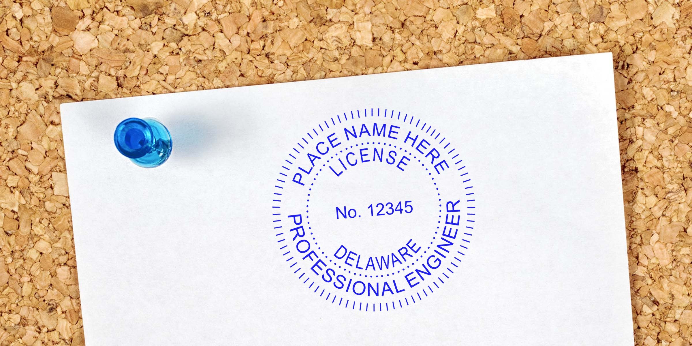Delaware professional engineer license stamp on white paper pinned to corkboard, displaying Delaware engineer seal dimensions per the engineer seal size guide.
