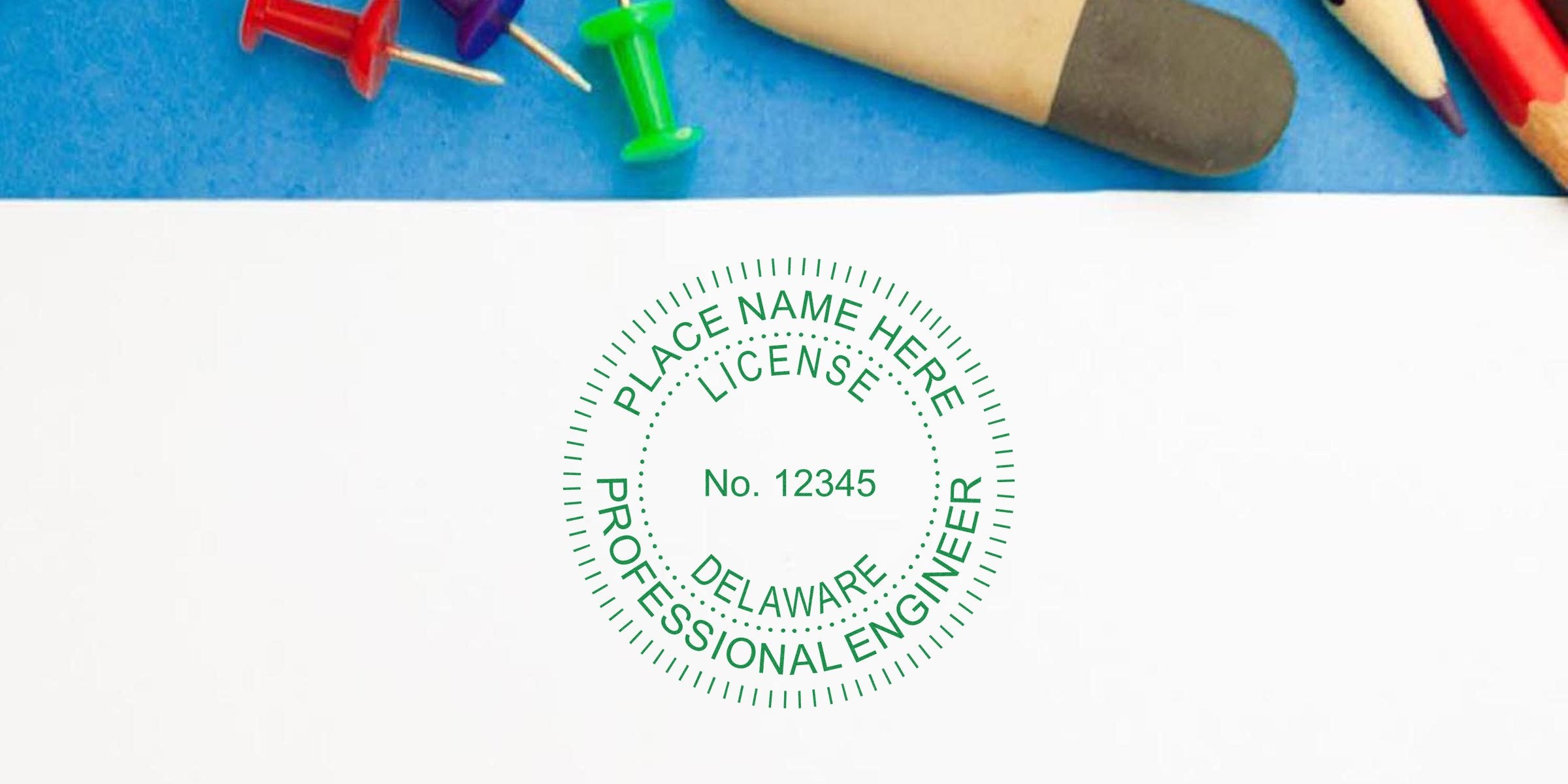 Delaware professional engineer license stamp on white paper with office supplies, showing stamp size and meeting Delaware engineering stamp requirements.