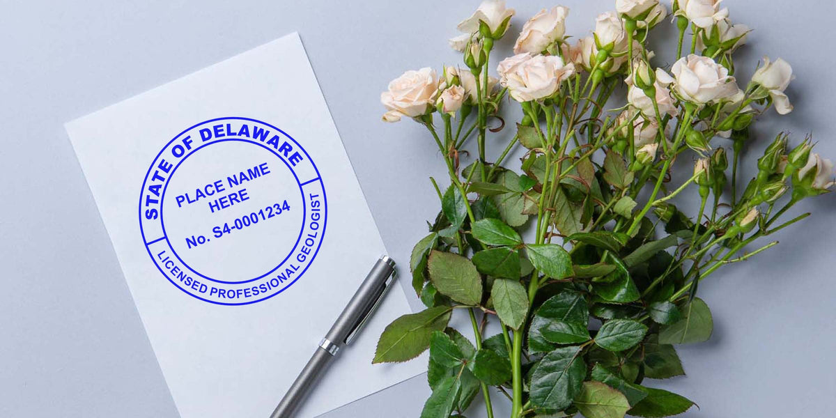 Delaware licensed professional geologist stamp on paper with pen and white rose bouquet, showing Delaware geologist seal and its specifications.