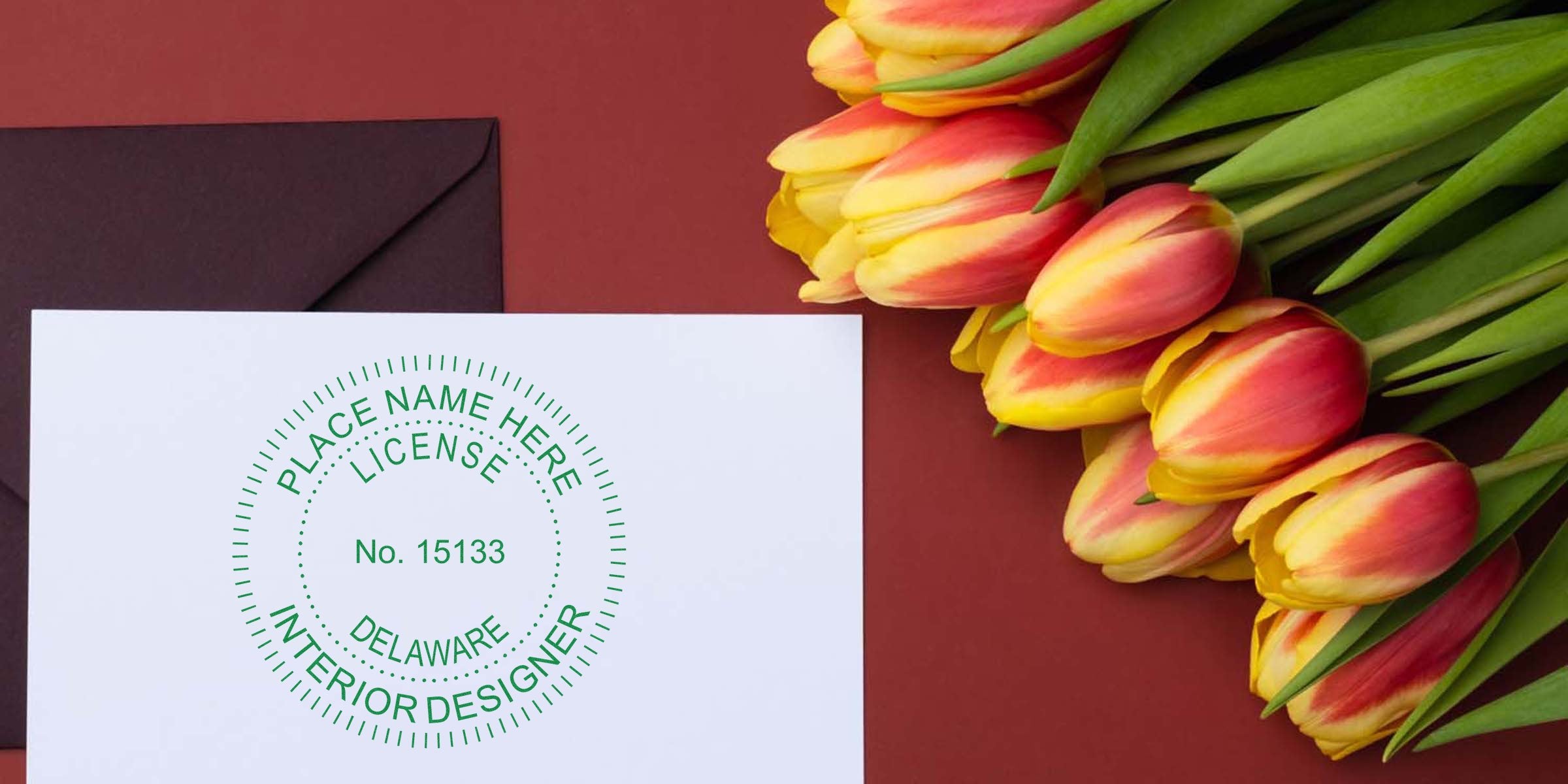 Yellow and red tulips beside a Delaware Interior Designer Seal Embosser license on white paper with a dark envelope, set against a red background, highlighting Delaware Interior Design tools.