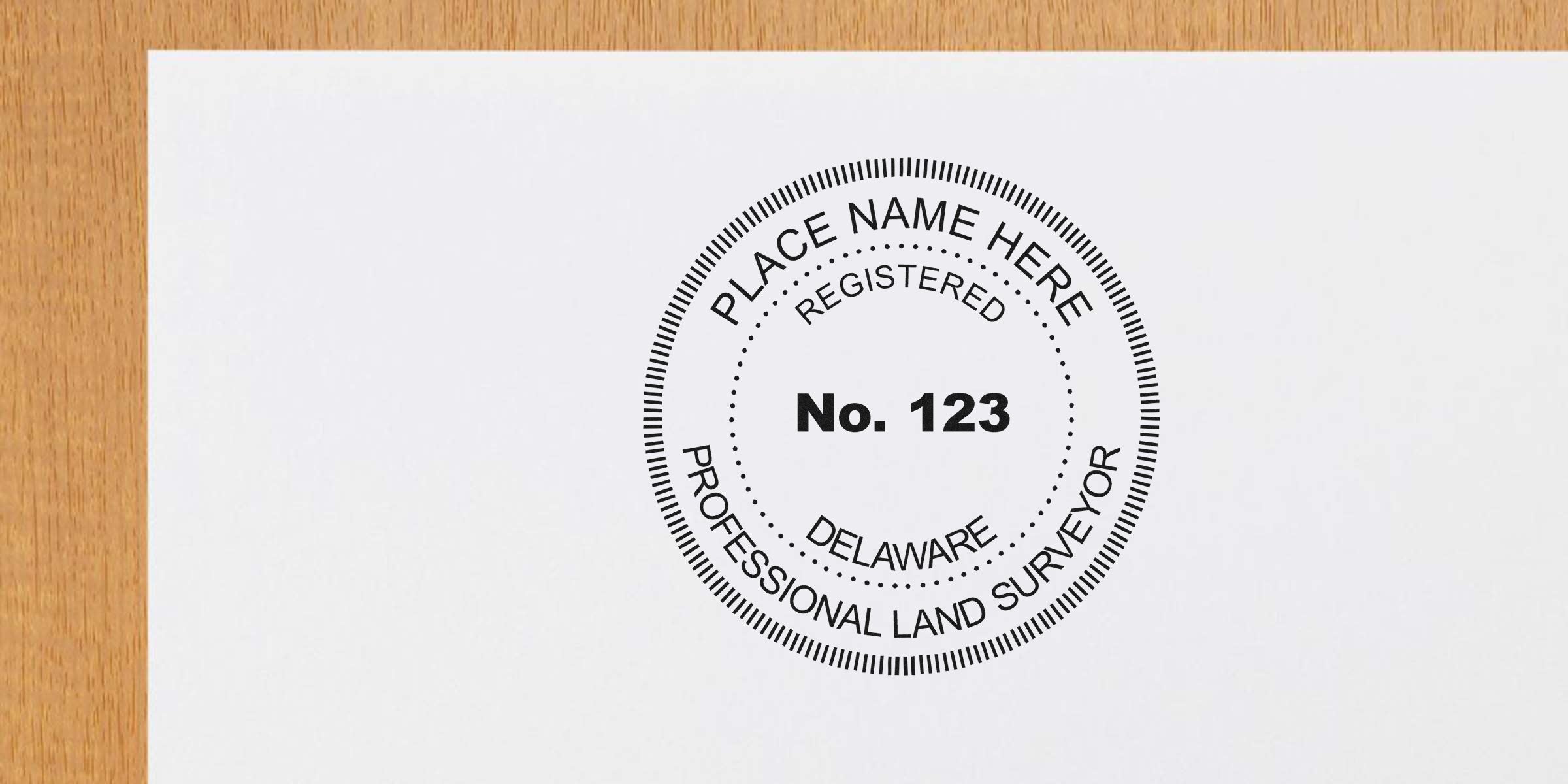 Delaware land surveyor stamp with professional design and registered number 123 on white paper.