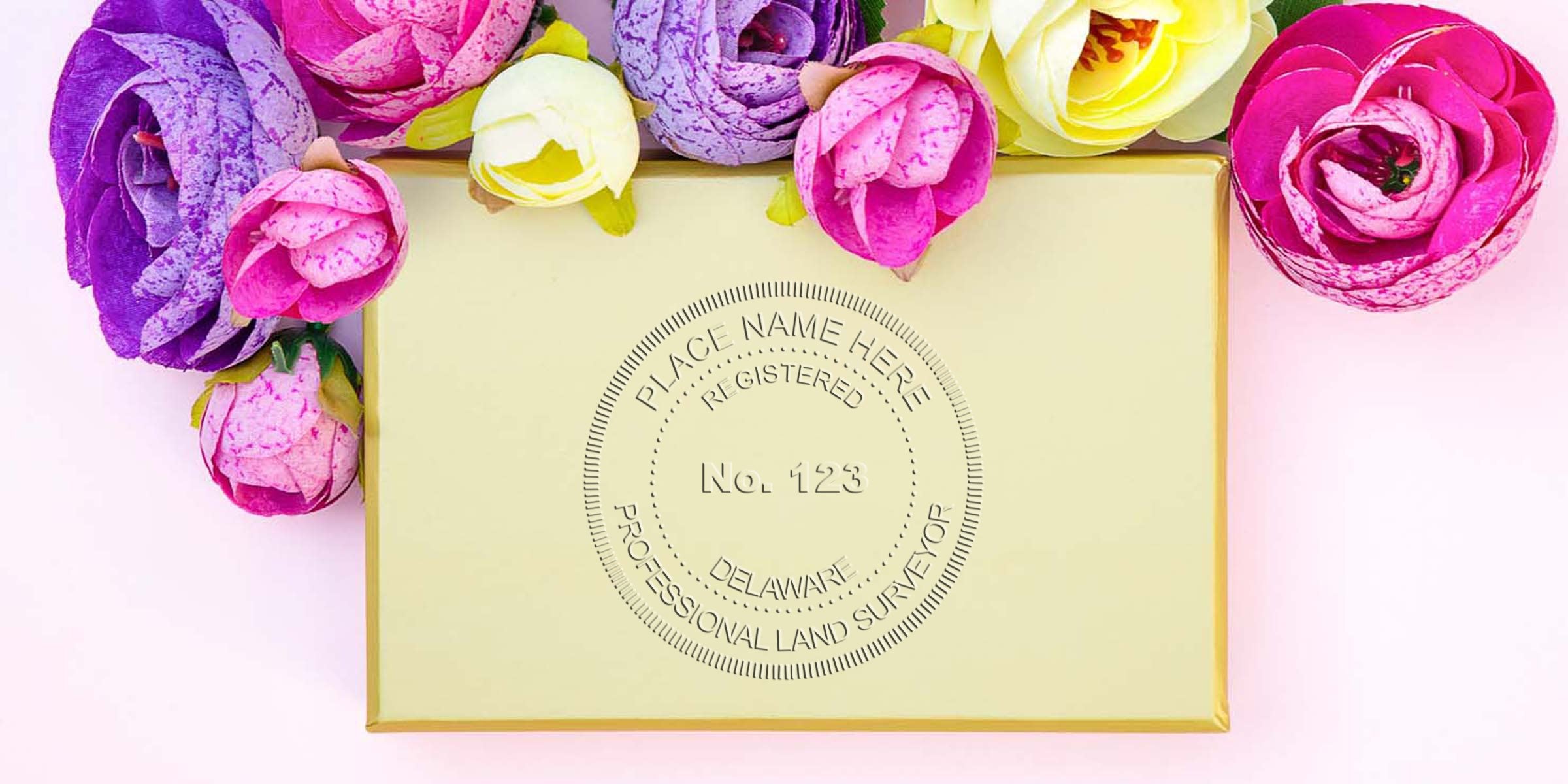 Gold gift box with colorful artificial flowers, luxury packaging, and elegant wrapping, inspired by Delaware land surveyor seal and its guidelines.