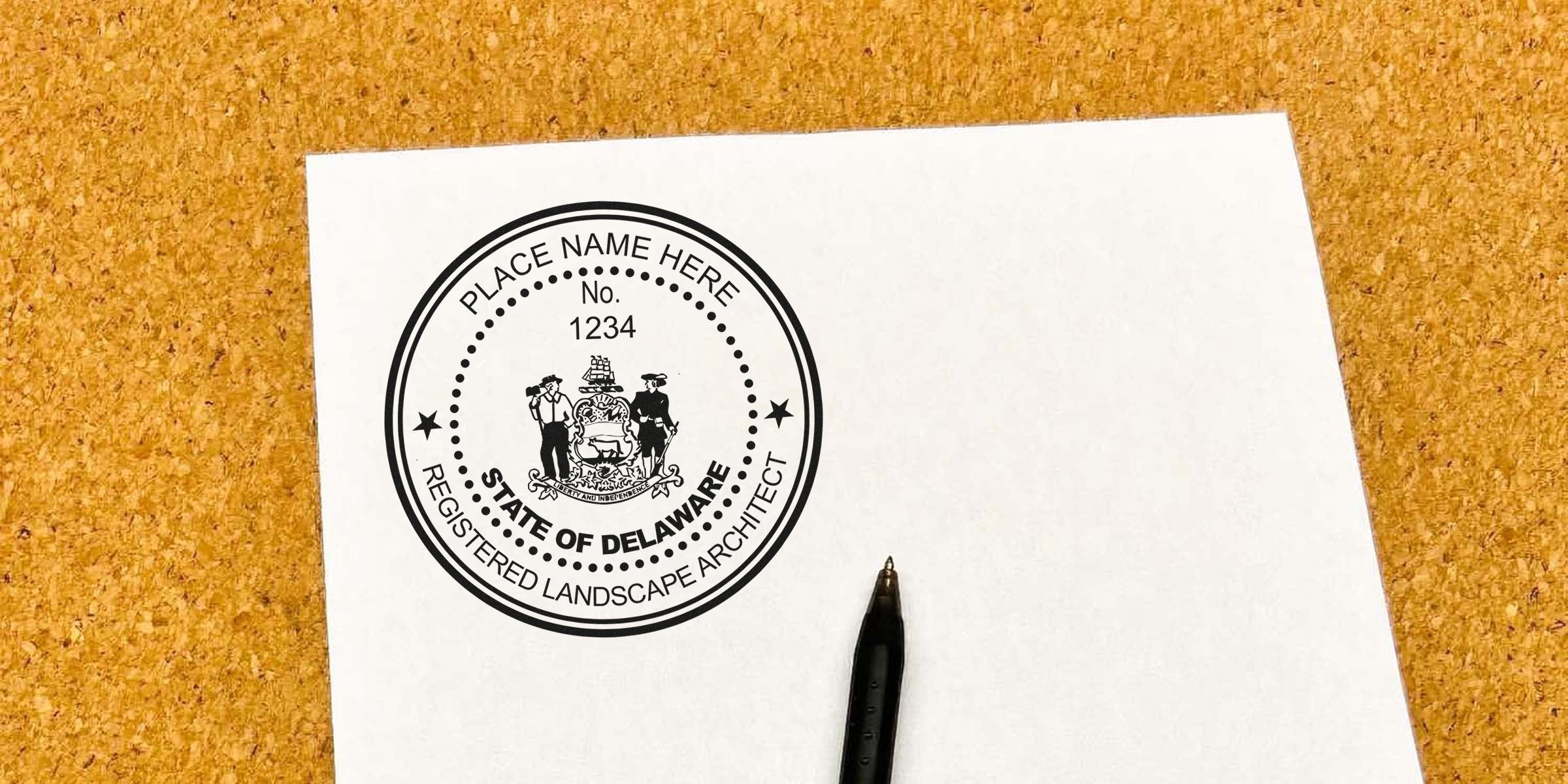 Custom rubber stamp for Delaware landscape architect on white paper with black pen, showing Delaware landscape architect design and referencing licensing criteria.