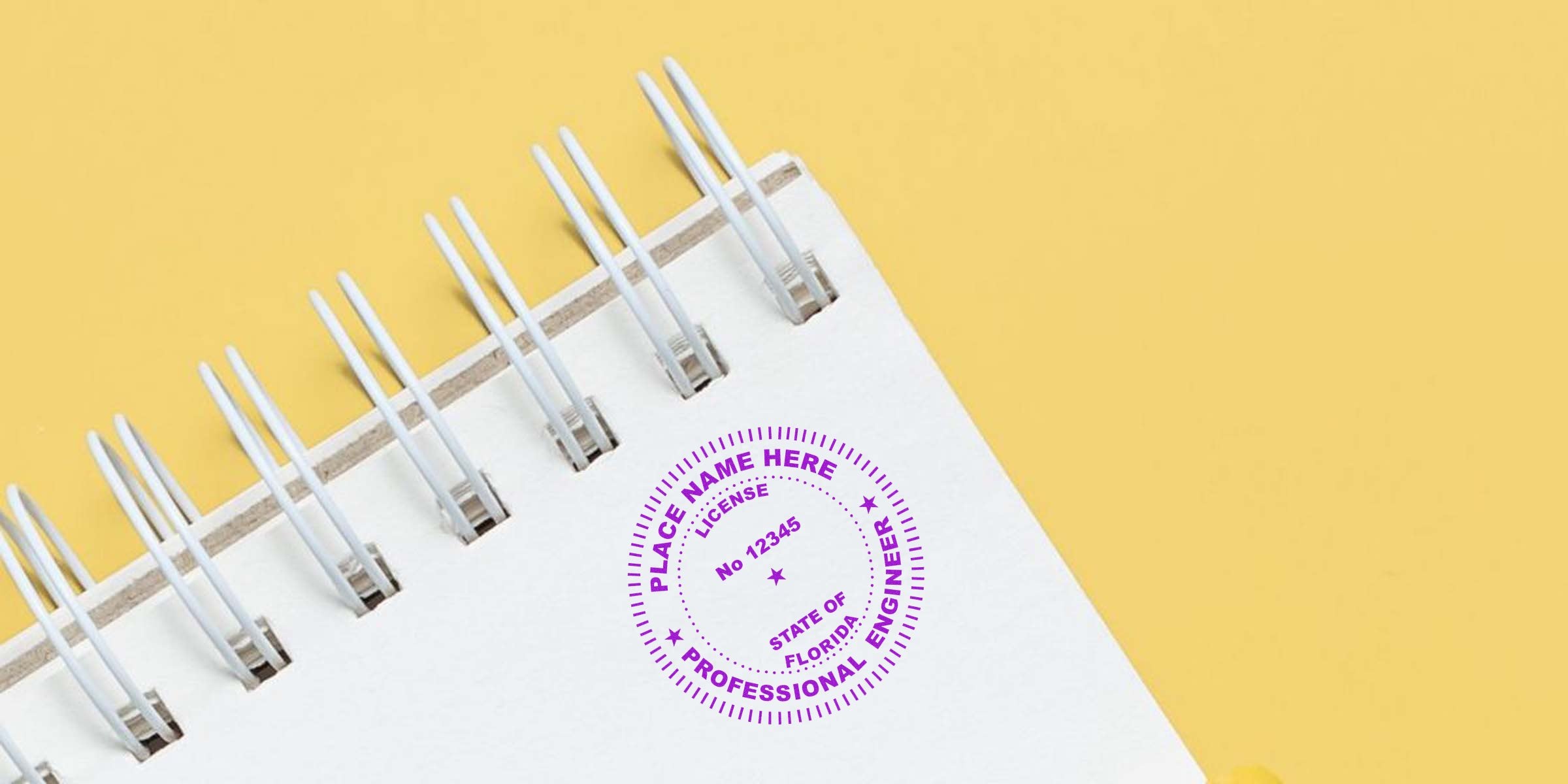 Florida engineering seal stamp on white spiral notebook against yellow background, emphasizing engineering seal requirements.