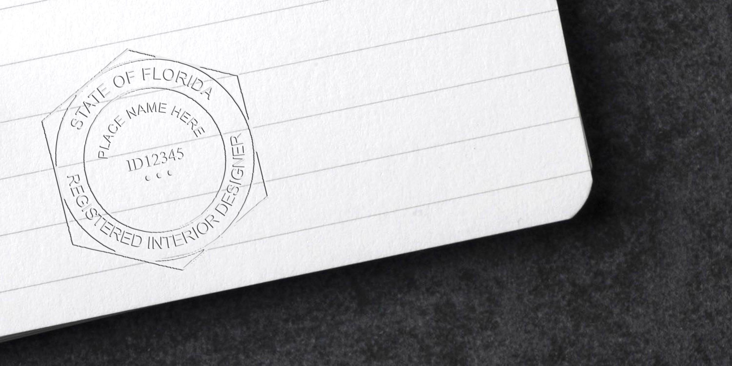 Florida interior designer stamp on white lined paper, displaying license and meeting stamp requirements.