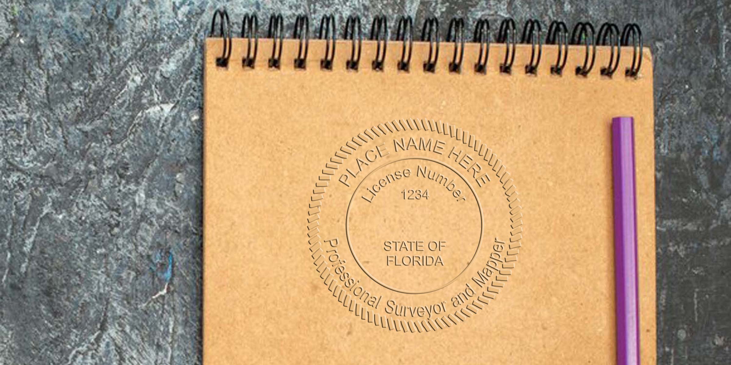 Brown spiral notebook with purple pen on textured surface, embossed Florida land surveyor stamp, professional surveyor and mapper license seal, State of Florida license #1234, following land surveyor stamp size rules.