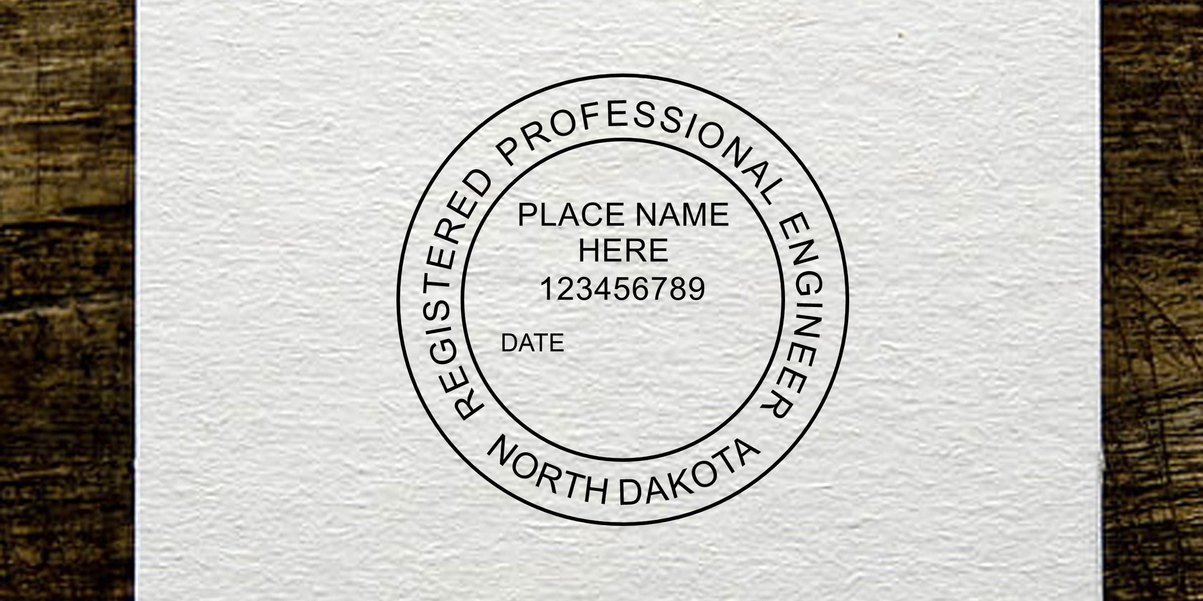 North Dakota registered professional engineer seal stamp template with placeholder text, displayed on textured white paper over a wood background