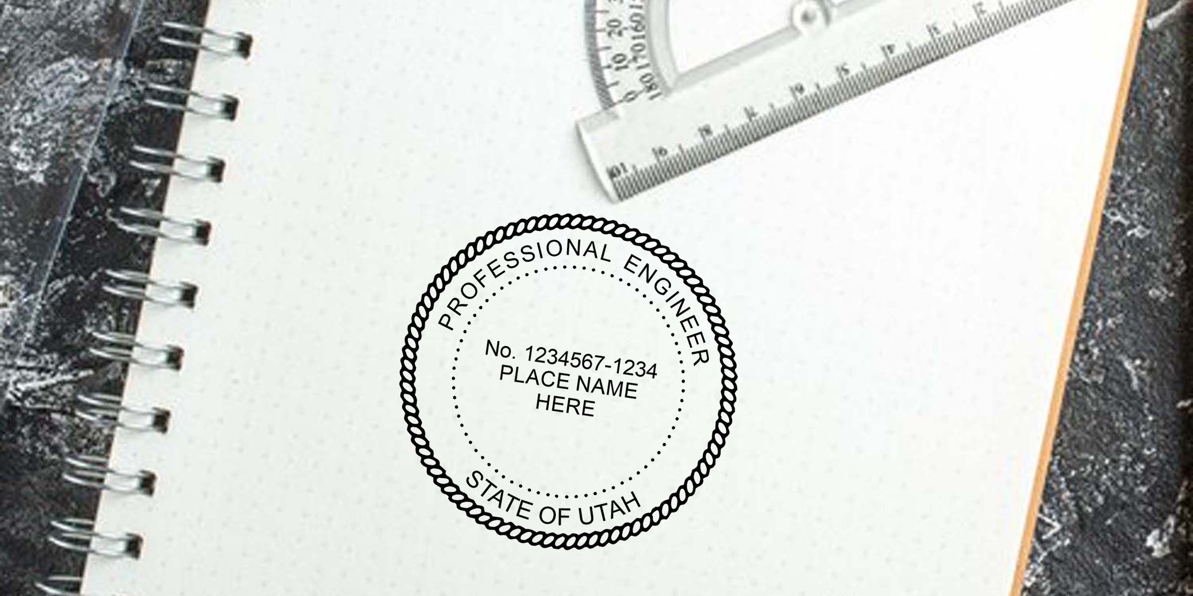 Engineering notebook with ruler and professional engineer seal for State of Utah on a spiral-bound page, representing licensed civil or structural engineering documents