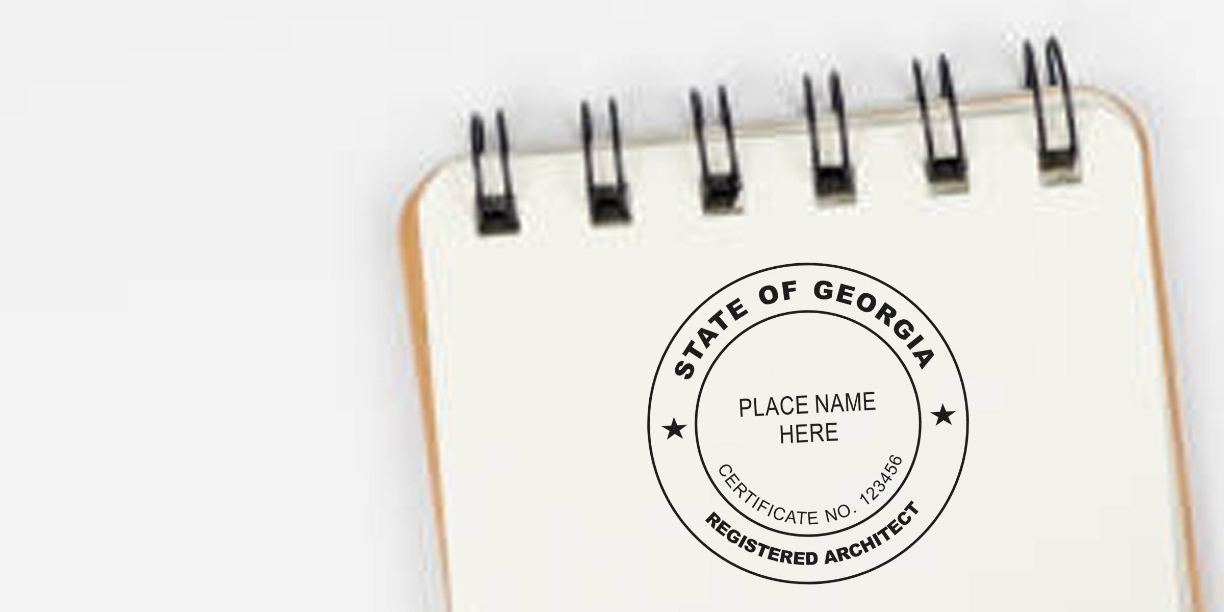 Georgia architect stamp embossed on spiral notebook, showing architectural certification and license verification using embossing tools.
