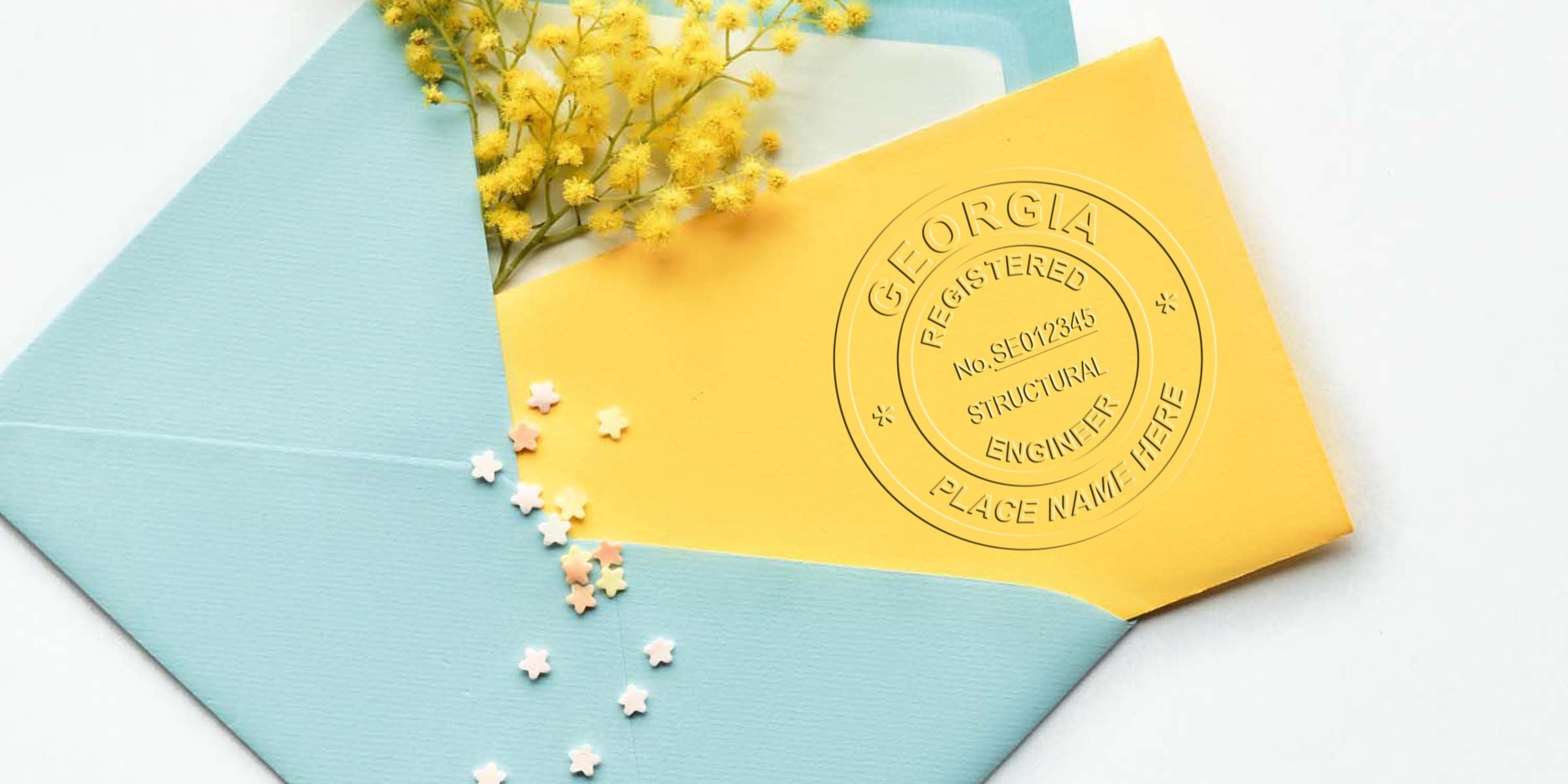 Yellow envelope with a Georgia-registered structural engineer seal inside a blue envelope decorated with yellow flowers and star confetti, highlighting Georgia engineer seal cost and price.