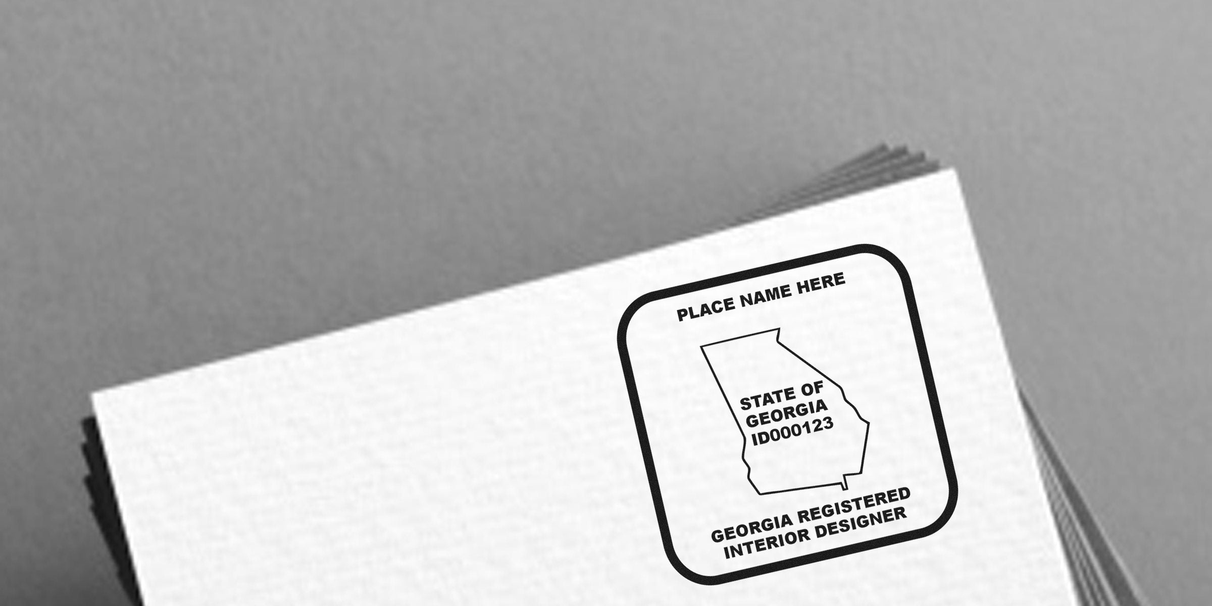 Georgia registered interior designer stamp on white paper confirming certification meets Georgia interior design regulations and licensing requirements.