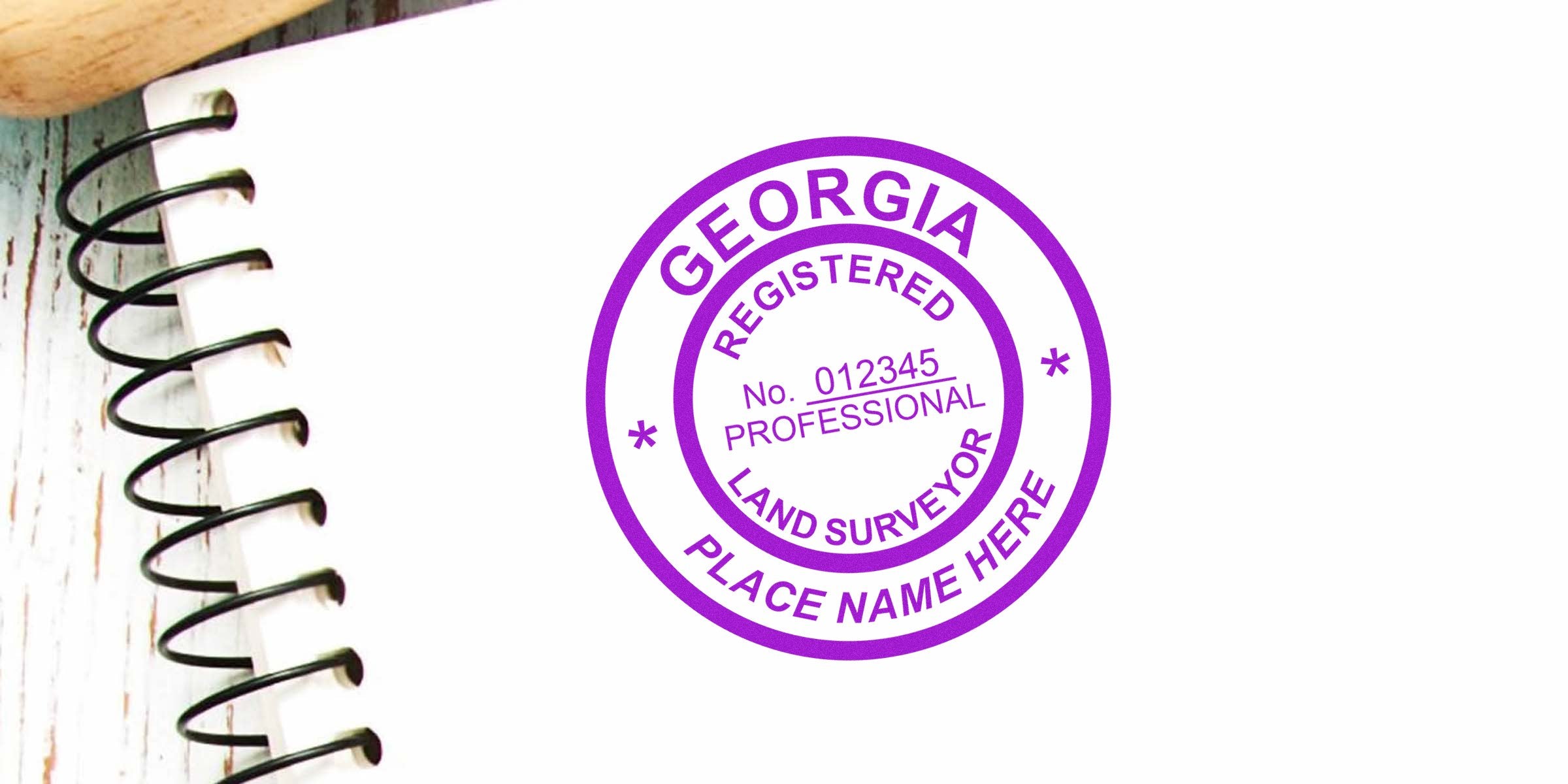 Georgia land surveyor stamp on spiral notebook, highlighting land surveyor costs and stamp prices in Georgia.