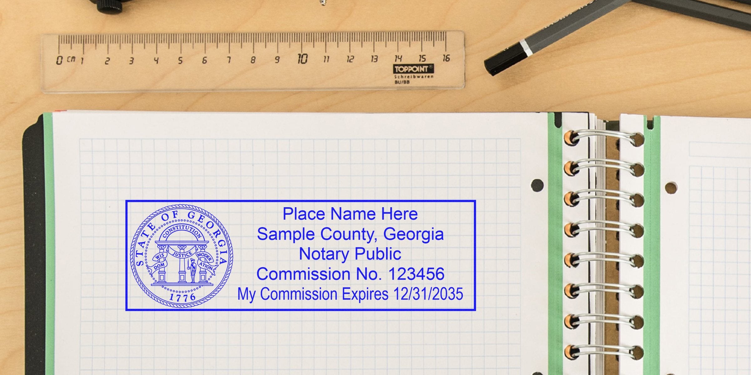 Georgia notary seal stamp with commission number and expiration date on graph paper notebook. Buy your notary seal online today.