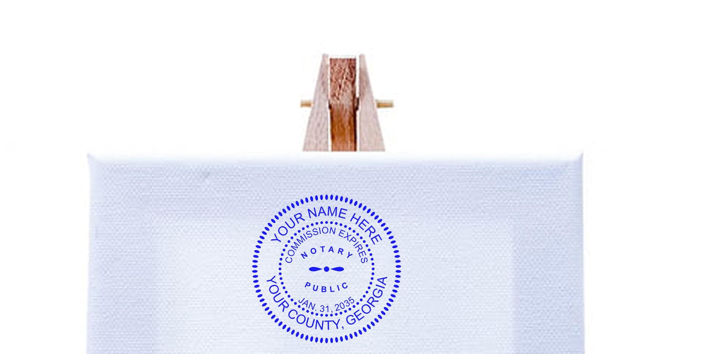 Custom wooden-handled notary stamp with personalized Georgia seal and official commission expiration date for full notary compliance.