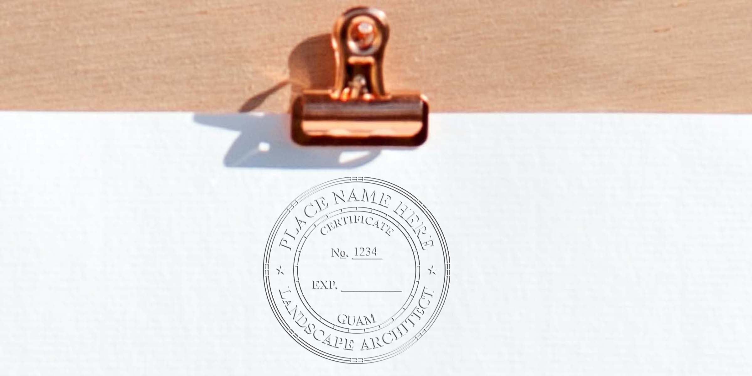Copper clip holds white certificate paper with Guam landscape architect stamp and certification details, linked to landscape architect stamp order.