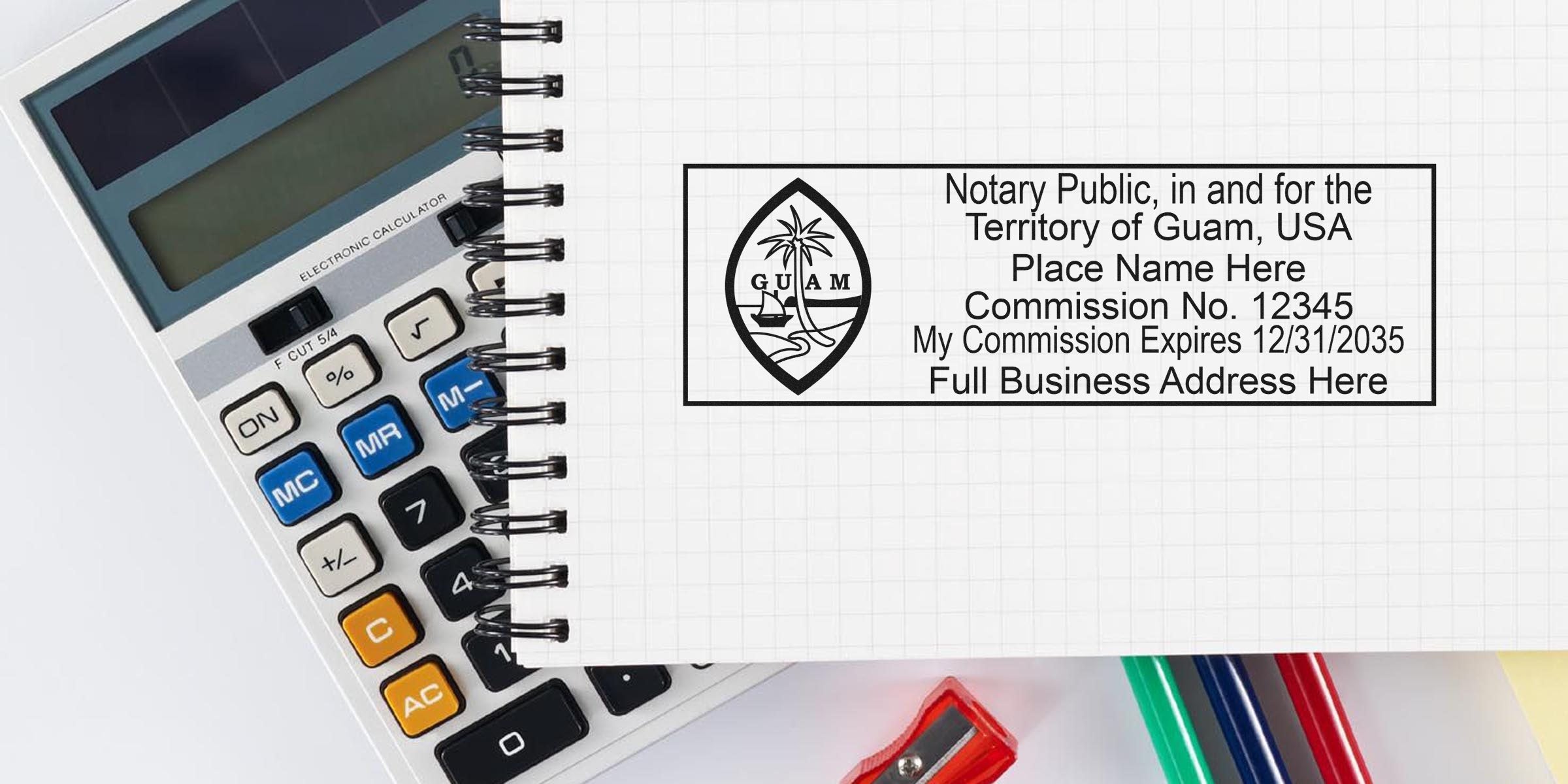 Notary stamp from Guam on a notebook with a calculator and colored pens for official document certification, featured in the Guam notary guide.