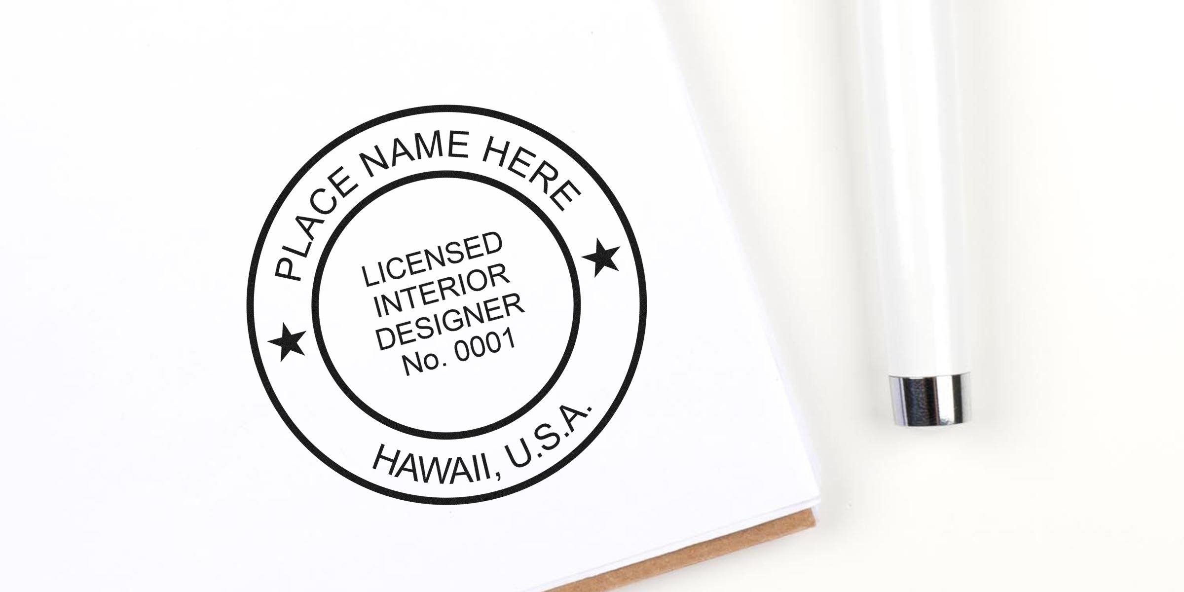 Licensed interior designer stamp on white paper with pen, displaying Hawaii USA certification seal, meeting Hawaii interior designer and legal seal requirements.
