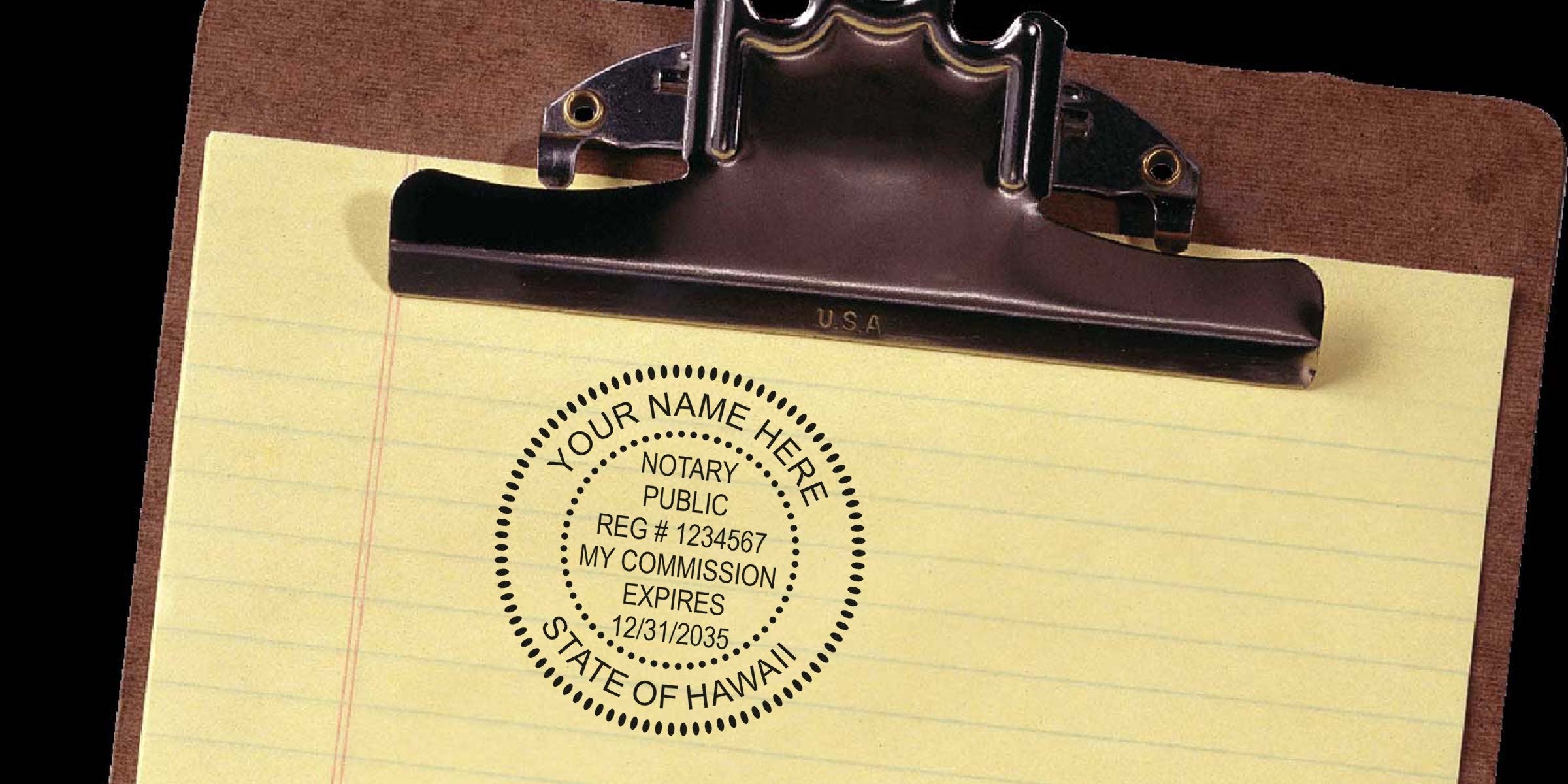 Hawaii notary stamp on yellow legal pad with clipboard, showing official notary seal and Hawaii notary commission seal.