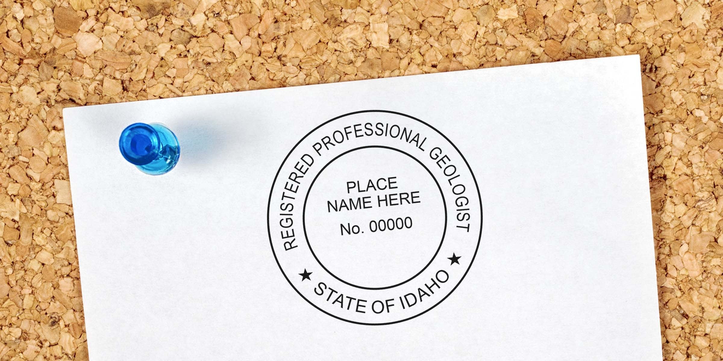 Registered Professional Geologist seal pinned on corkboard with blue pushpin, showing Idaho geologist stamp and meeting geologist stamp guidelines.