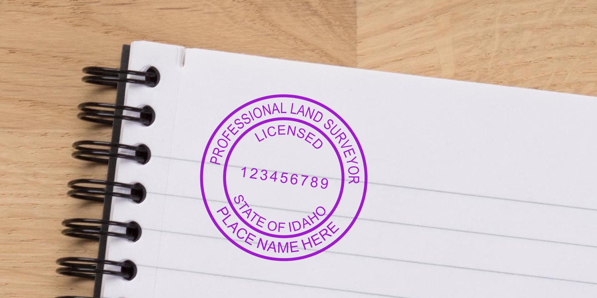 Idaho land surveyor stamp on notebook paper with licensed seal and state license, related to Idaho land surveyor application.