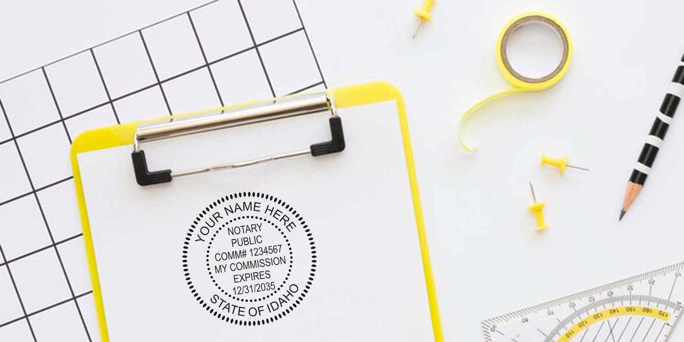 Yellow clipboard with Best Notary Seal Idaho stamp, surrounded by push pins, tape, pencil, and protractor on a white grid background for notary commission and certification.