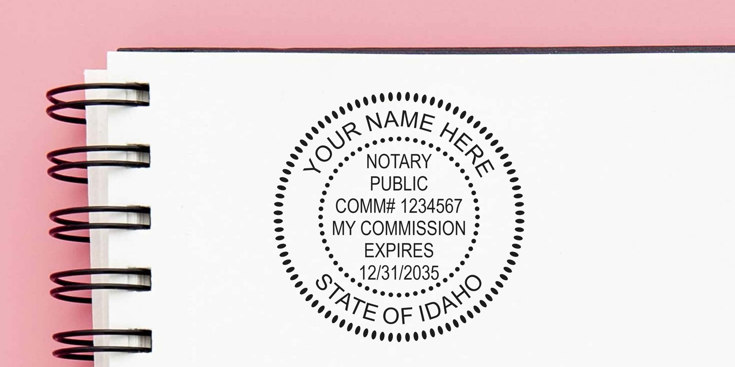 Custom Idaho notary stamp on white notebook page, showing Idaho notary rules, how to become a notary, and commission expiration date.