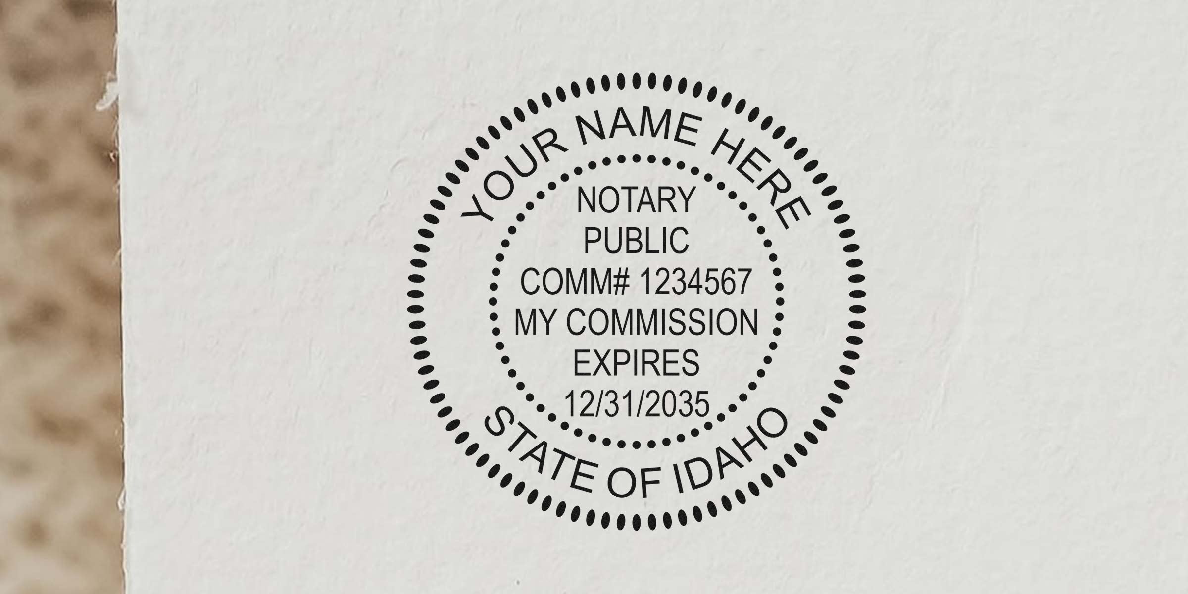 Idaho notary stamp with commission number and expiration date on white paper, part of Idaho notary seal guide.