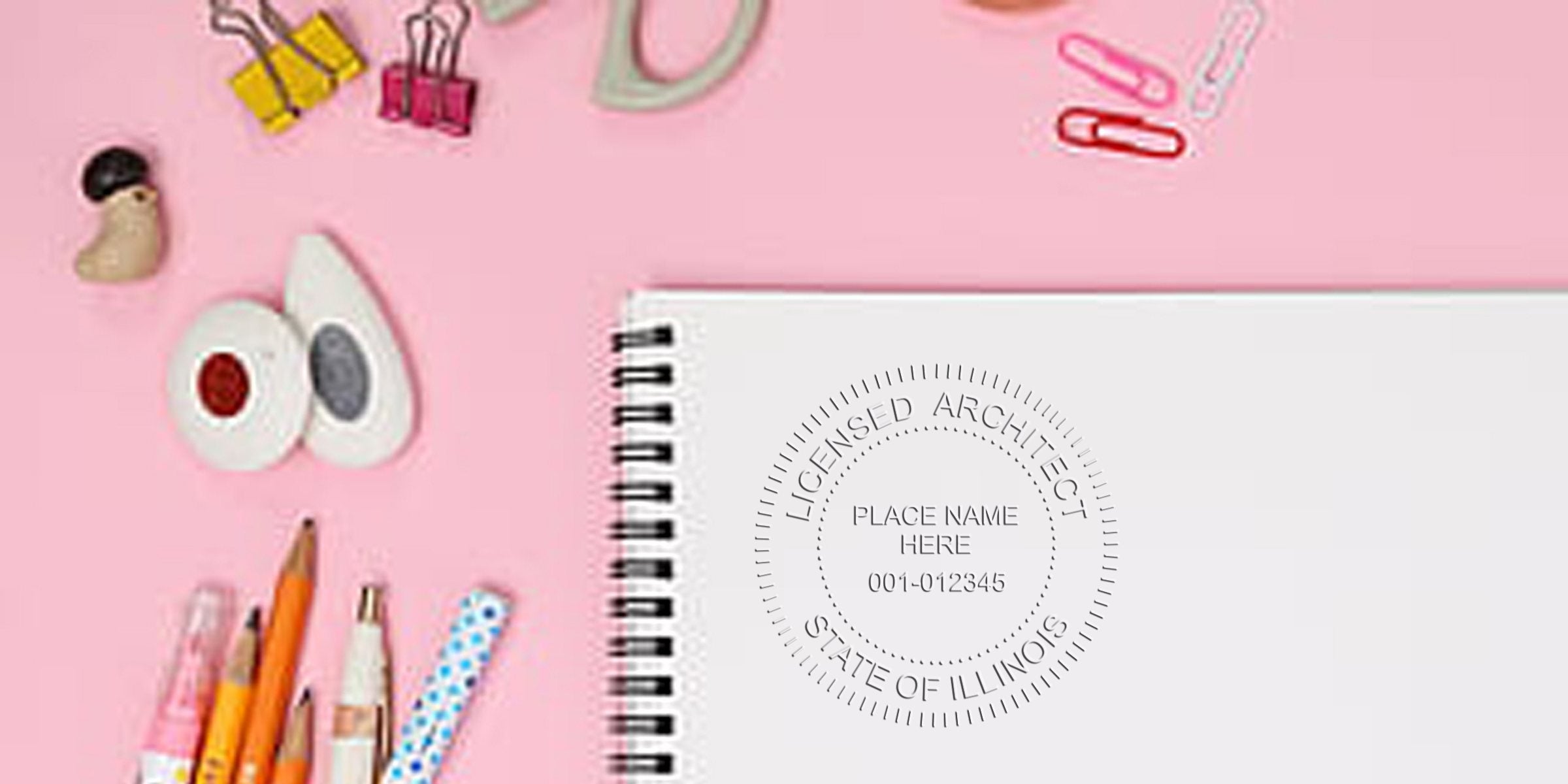 Pink background with office supplies—pencils, clips, correction tape, spiral notebook stamped with a licensed Illinois architect seal, highlighting Illinois architect stamp laws and requirements.