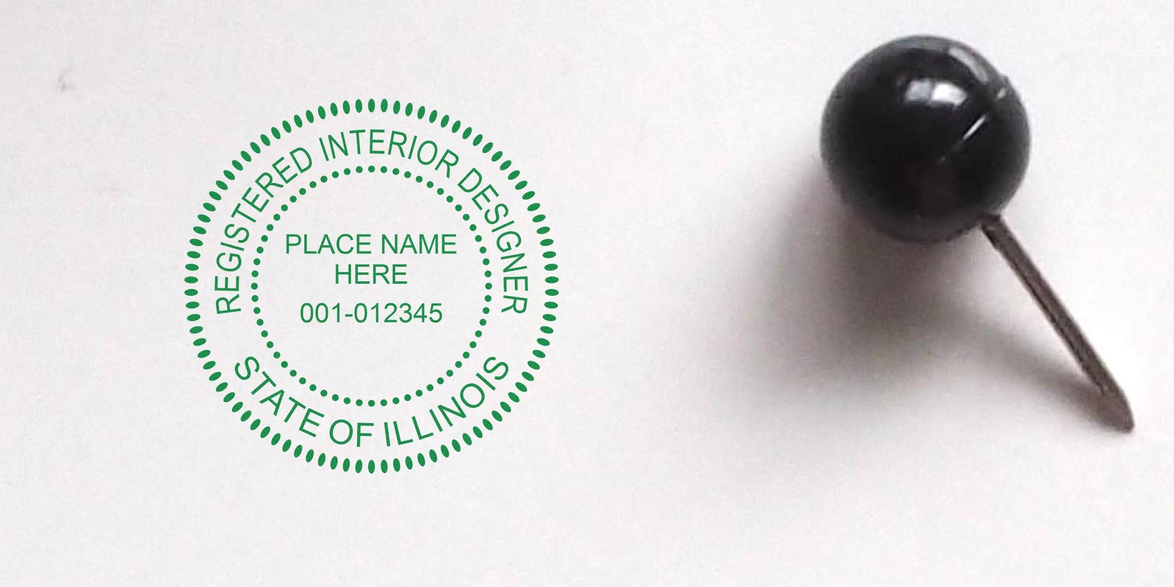 Illinois interior designer seal embossed with registered stamp, secured by black push pin on white background, highlighting interior design embossers.