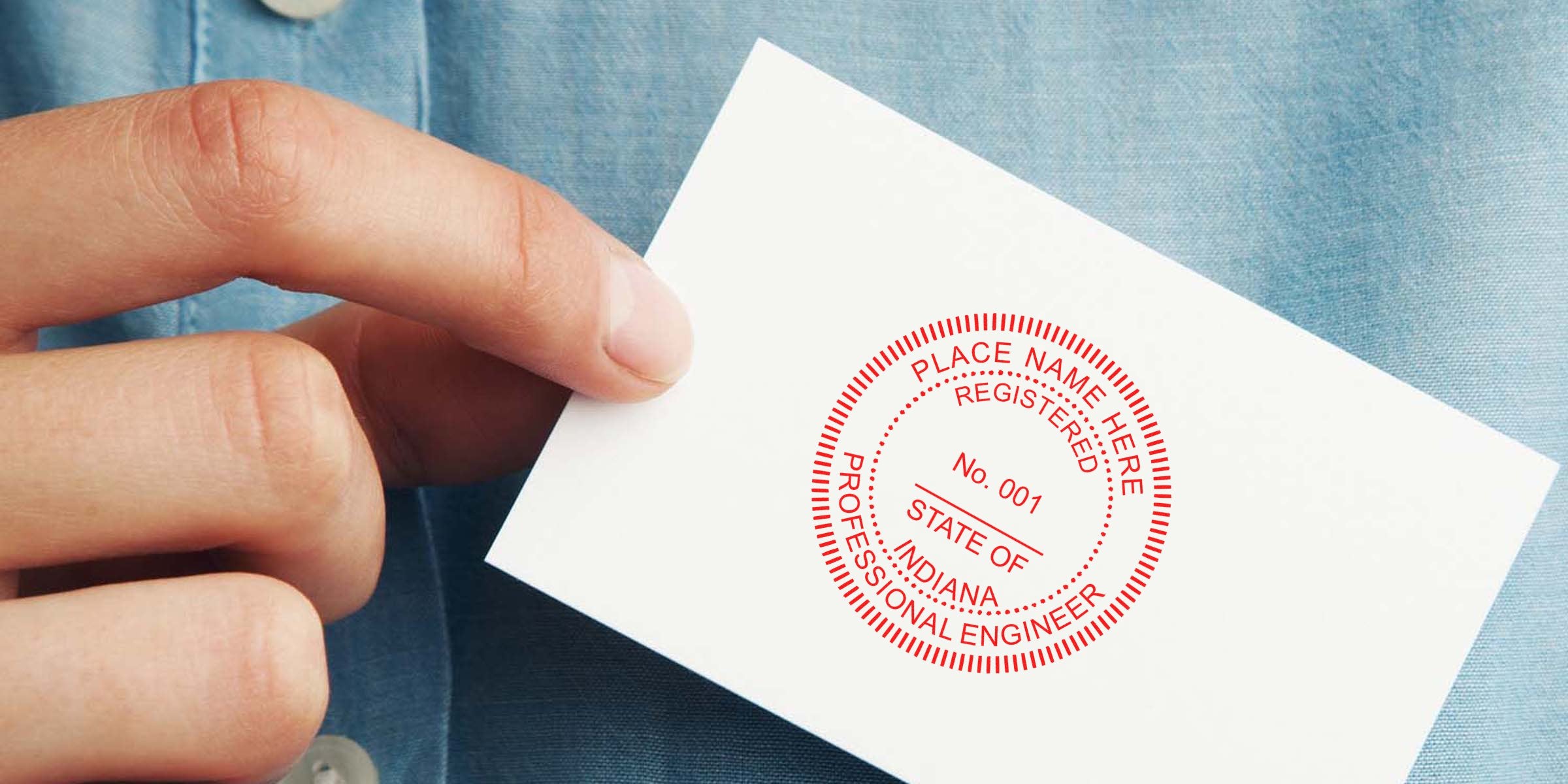 Hand holding a business card with Indiana professional engineer seal and registered stamp, highlighting custom engineer seals and Indiana engineer stamps for certification.