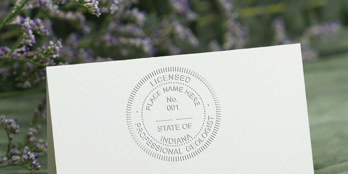 Embossed Indiana geologist seal on white paper with a floral background, displaying geologist seal design options.