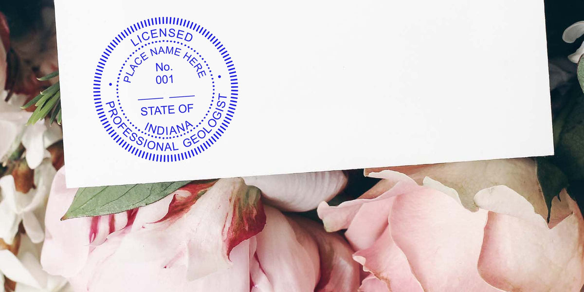 Indiana Professional Geologist stamp on white paper with pink flowers, highlighting the Geologist stamp process in Indiana.