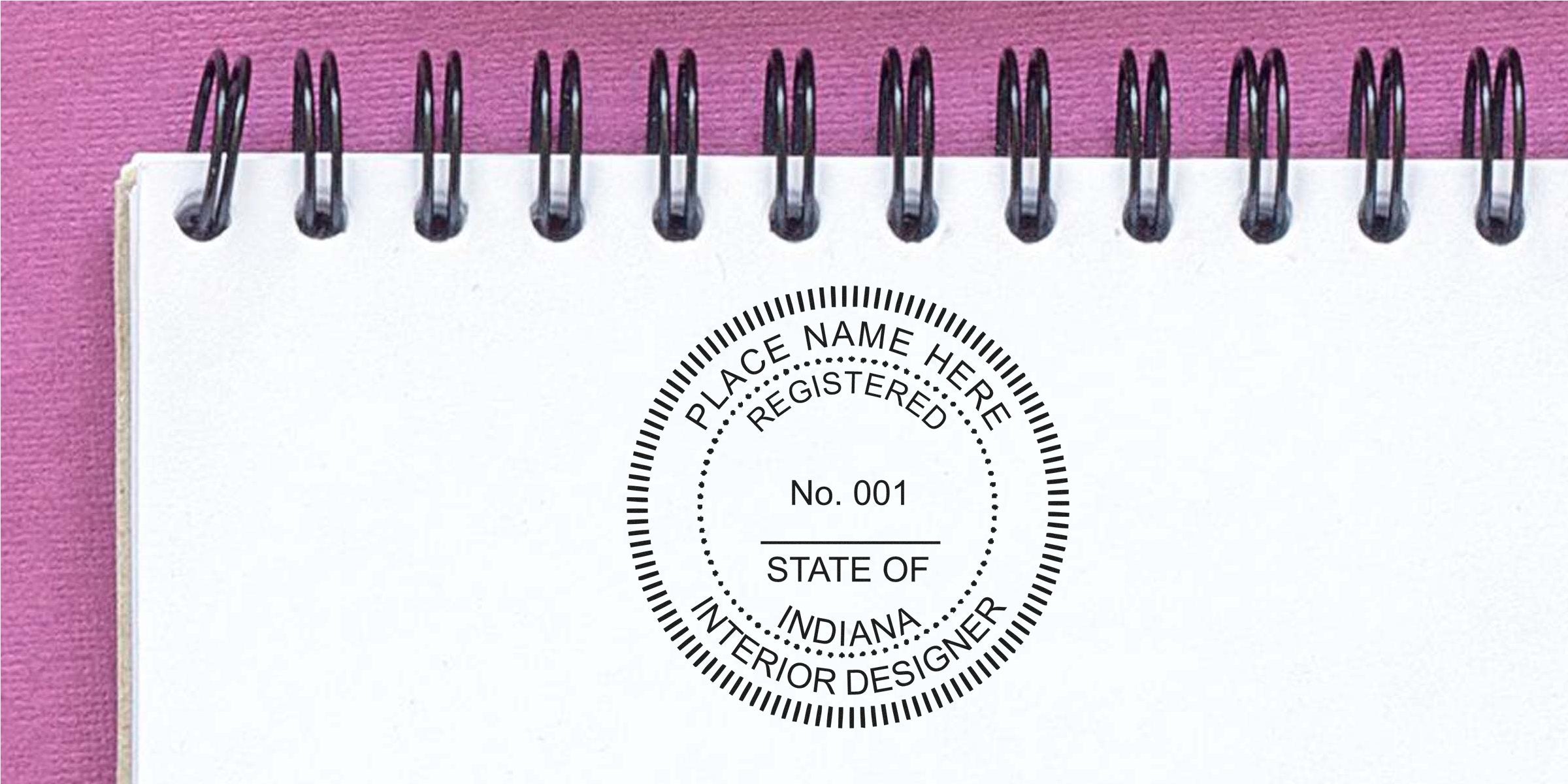 Custom interior designer seal stamped on a spiral notebook page, symbolizing registered interior design in Indiana.