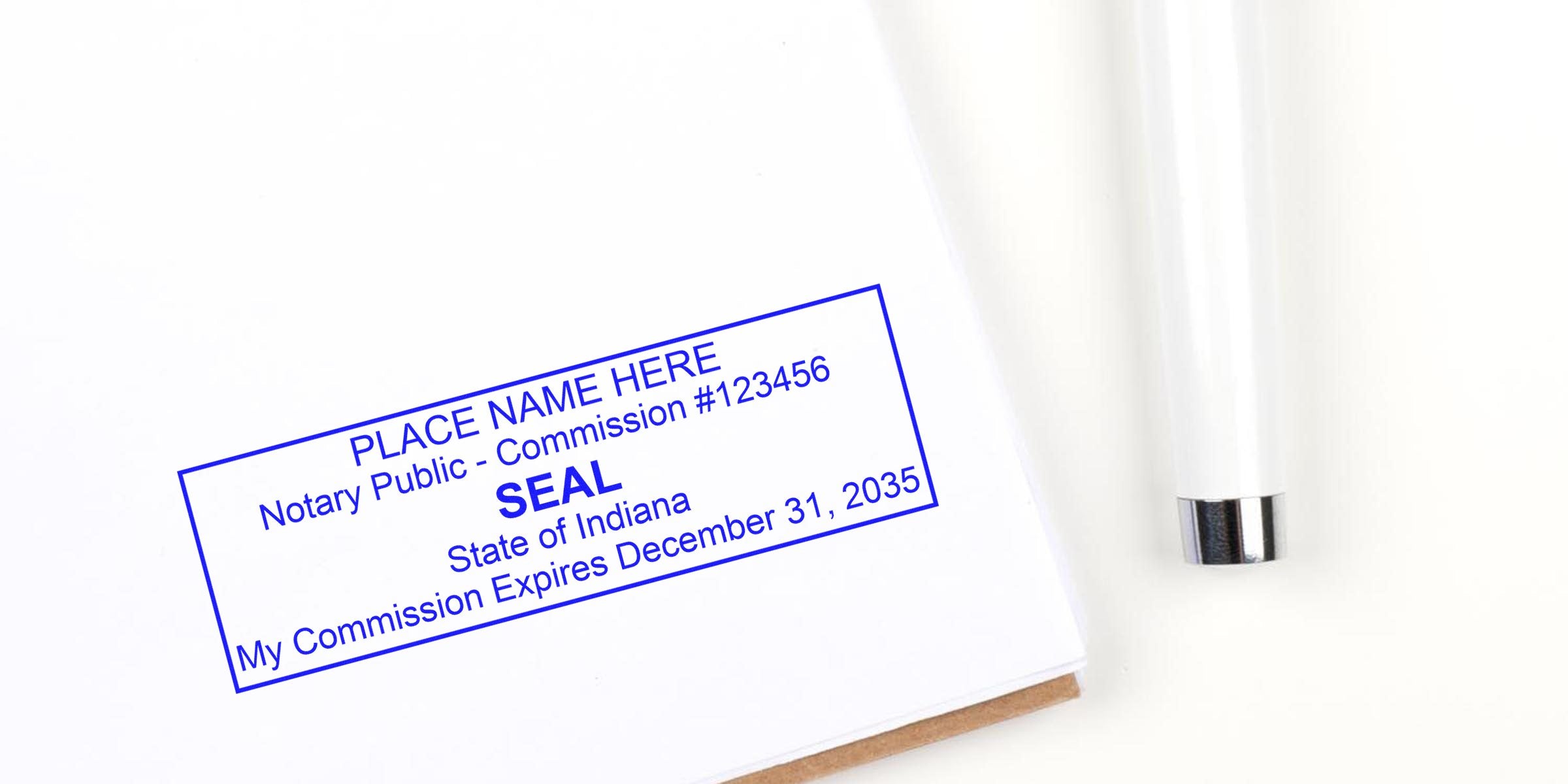 Indiana notary supplies with a notary public seal stamp on white paper, pen, official commission expiration date, and key seal elements for authenticating legal documents.