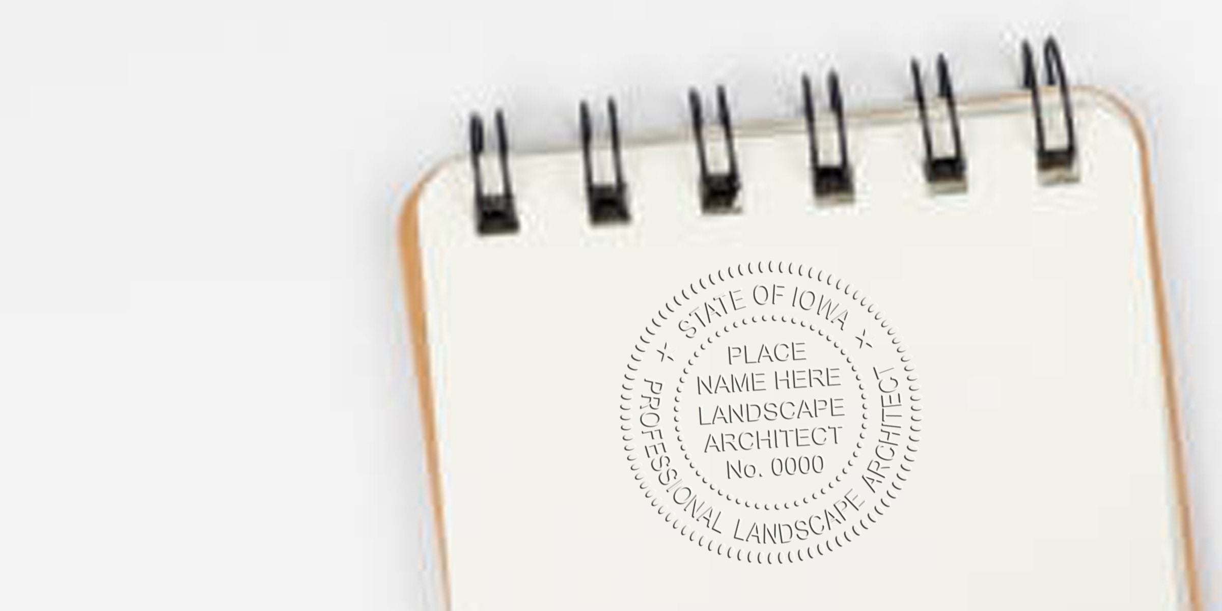 Custom Landscape Architect and Iowa Landscape Design embossed stamps on white spiral notebook for certification and licensing.