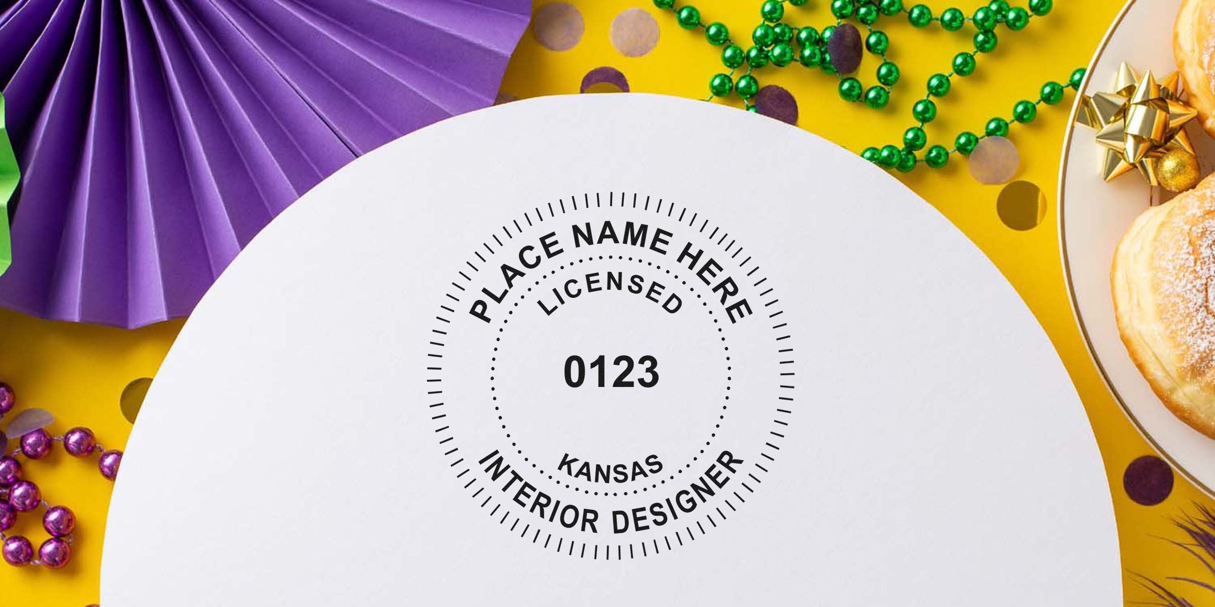 Kansas interior designer license stamp on white paper with colorful party decorations and donuts on yellow background, showcasing interior design stamp requirements.
