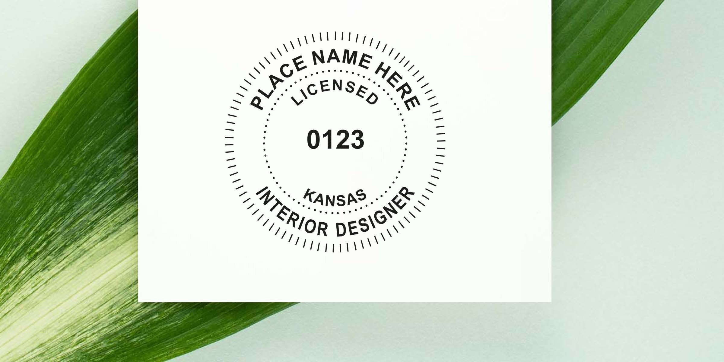 Kansas interior designer seal stamped on white paper with green leaf background, symbolizing Kansas interior design regulations.
