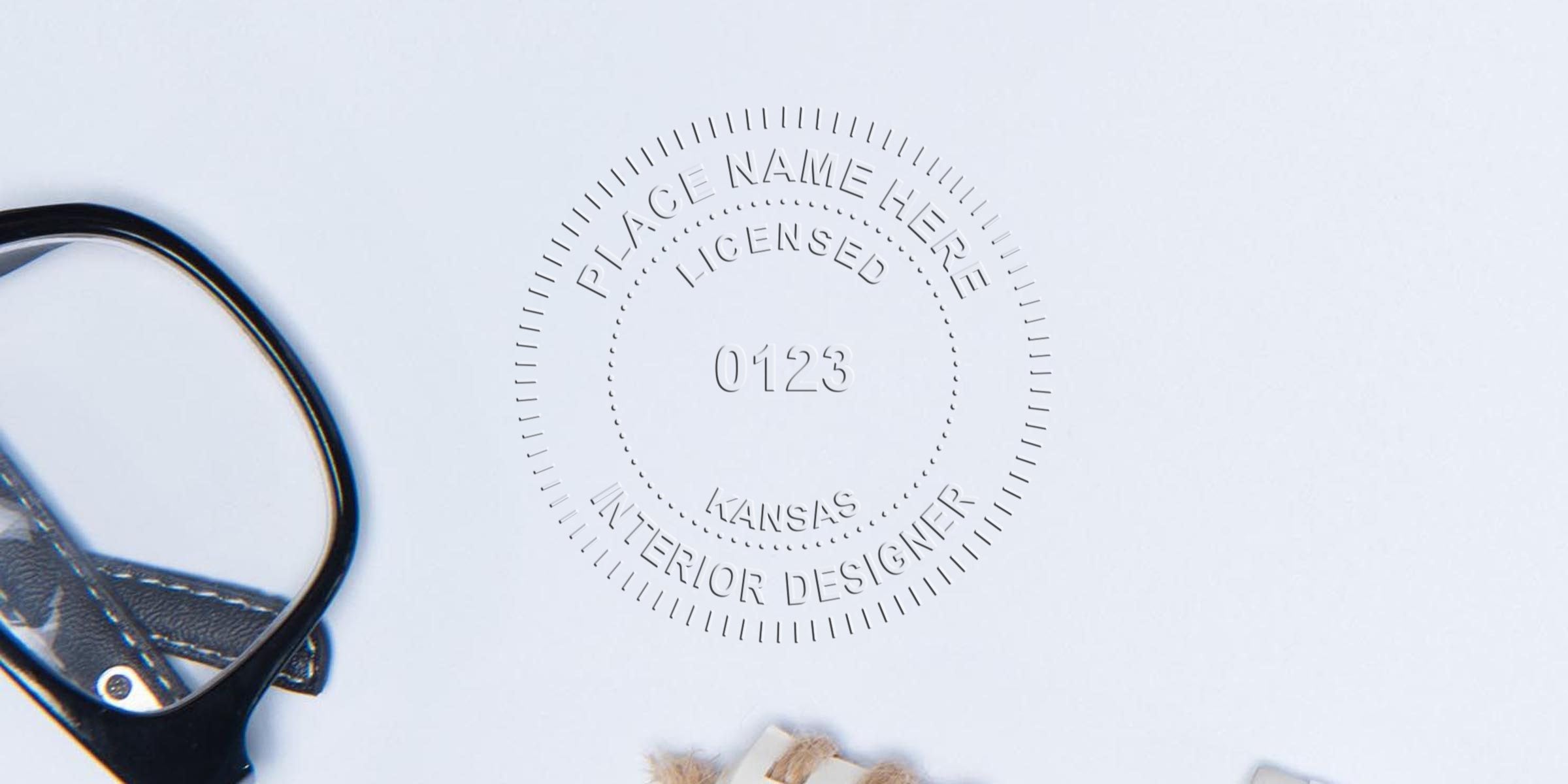 Licensed interior designer seal of Kansas with magnifying glass and leather strap on white background, emphasizing Kansas interior designer compliance and seal guidelines.